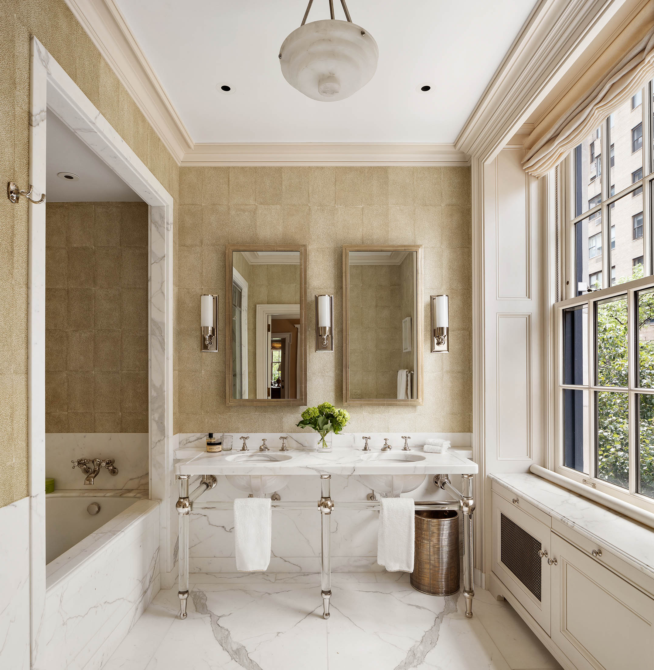 1030 5th Avenue, Unit 3W Manhattan, NY 10028 - Photo 13 of 22 a bathroom with a double vanity sink a toilet a mirror and shower