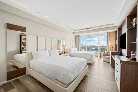 a view of a balcony with wooden floor and city view