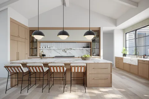 a kitchen with a table and chairs in it