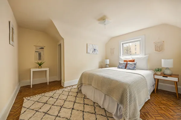 a bedroom with a bed and a table