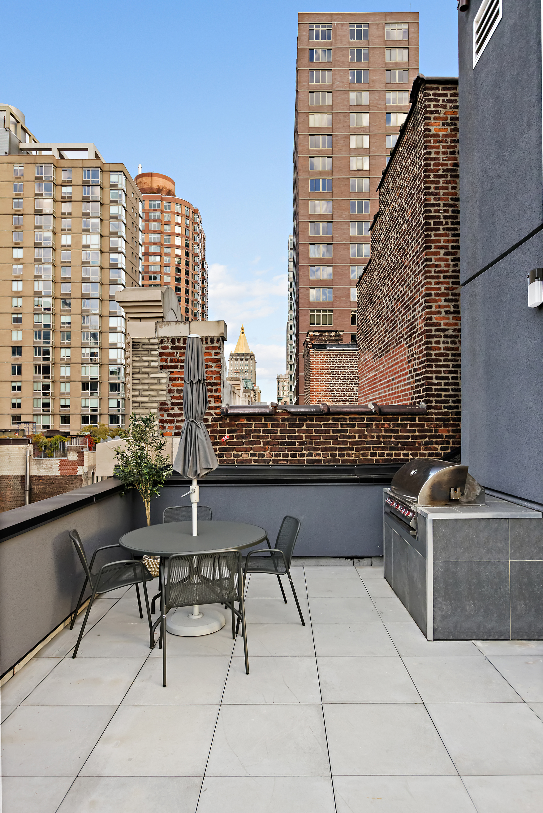 128 West 26th Street, Unit PH Manhattan, NY 10001 - Photo 18 of 21 a view of roof with potted plants and bench