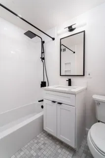 a bathroom with a sink a toilet and a bathtub