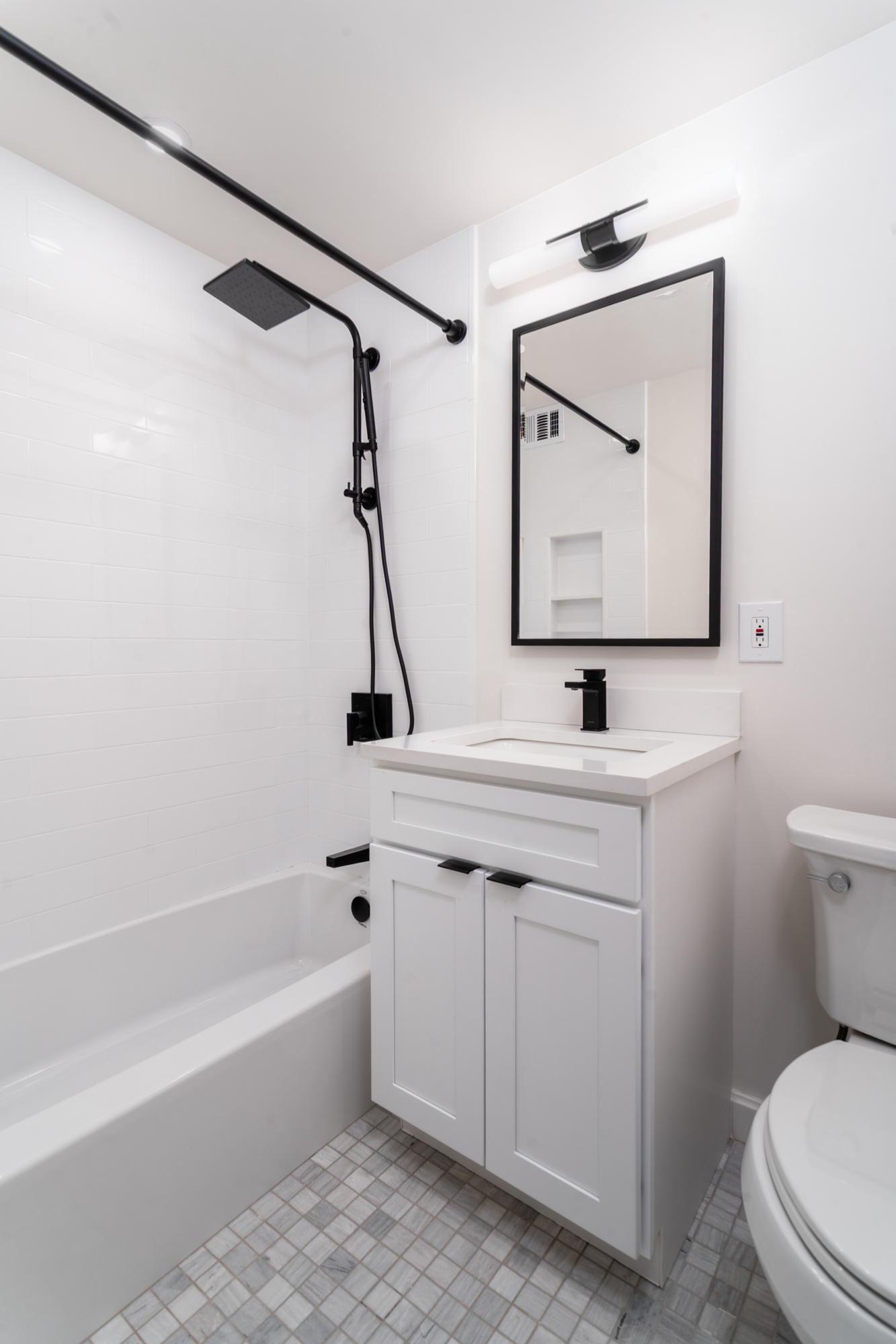 301 East 69th Street, Unit 2K Manhattan, NY 10021 - Photo 7 of 12 a bathroom with a sink a toilet and a bathtub
