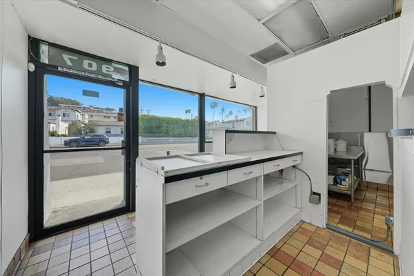 a view of a big room with closet and windows