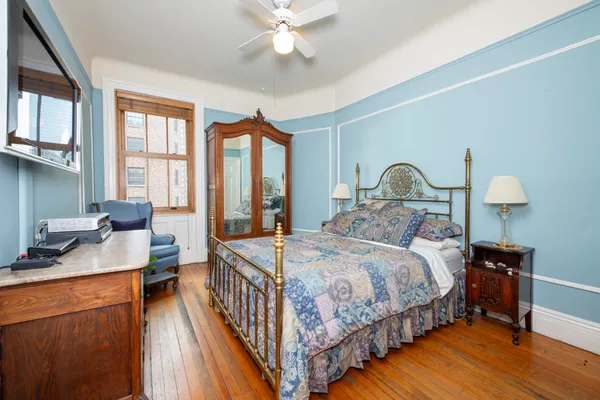 a bedroom with a bed and a table