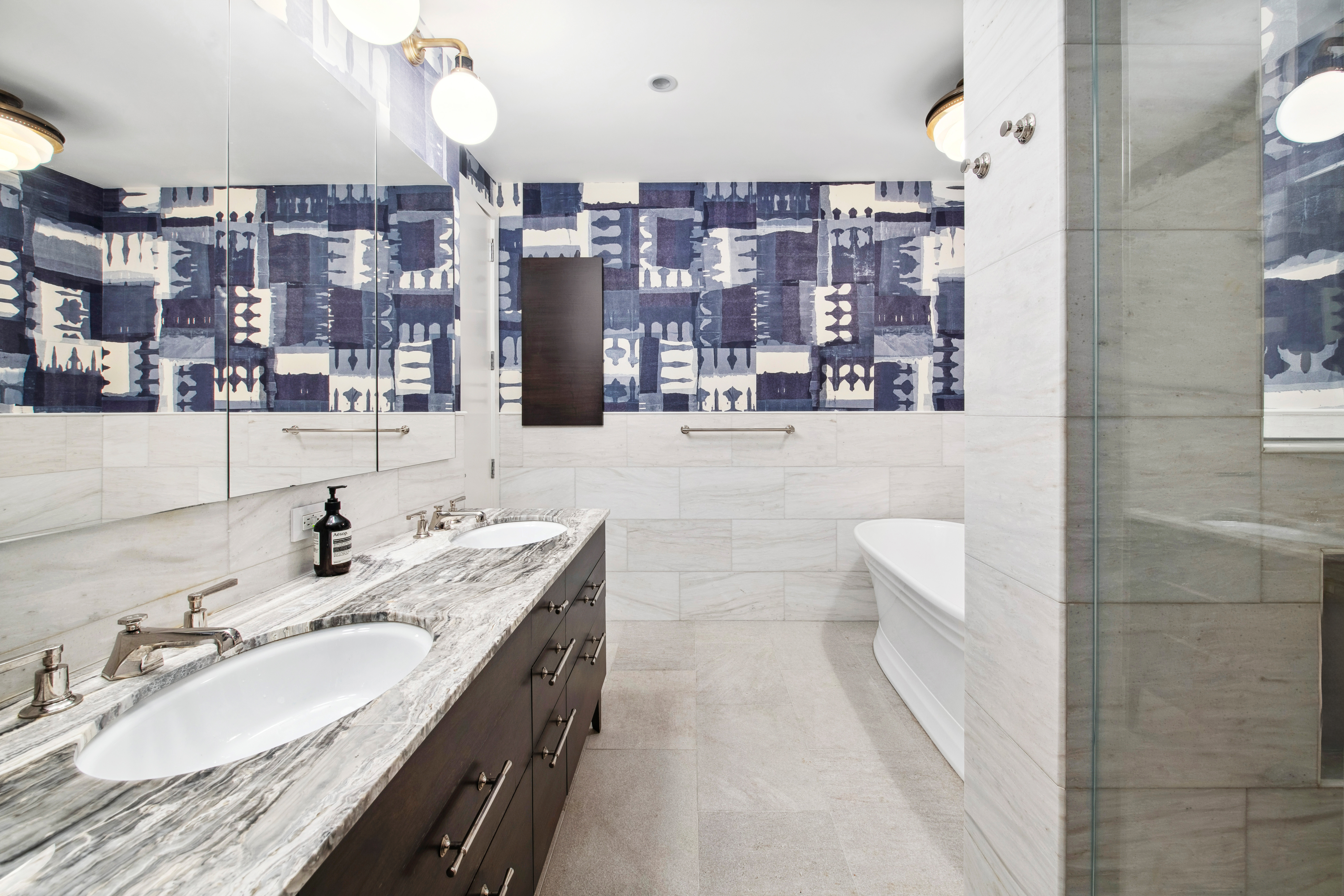 150 Nassau Street, Unit 10A Manhattan, NY 10038 - Photo 7 of 20 a bathroom with a granite countertop sink a toilet and shower