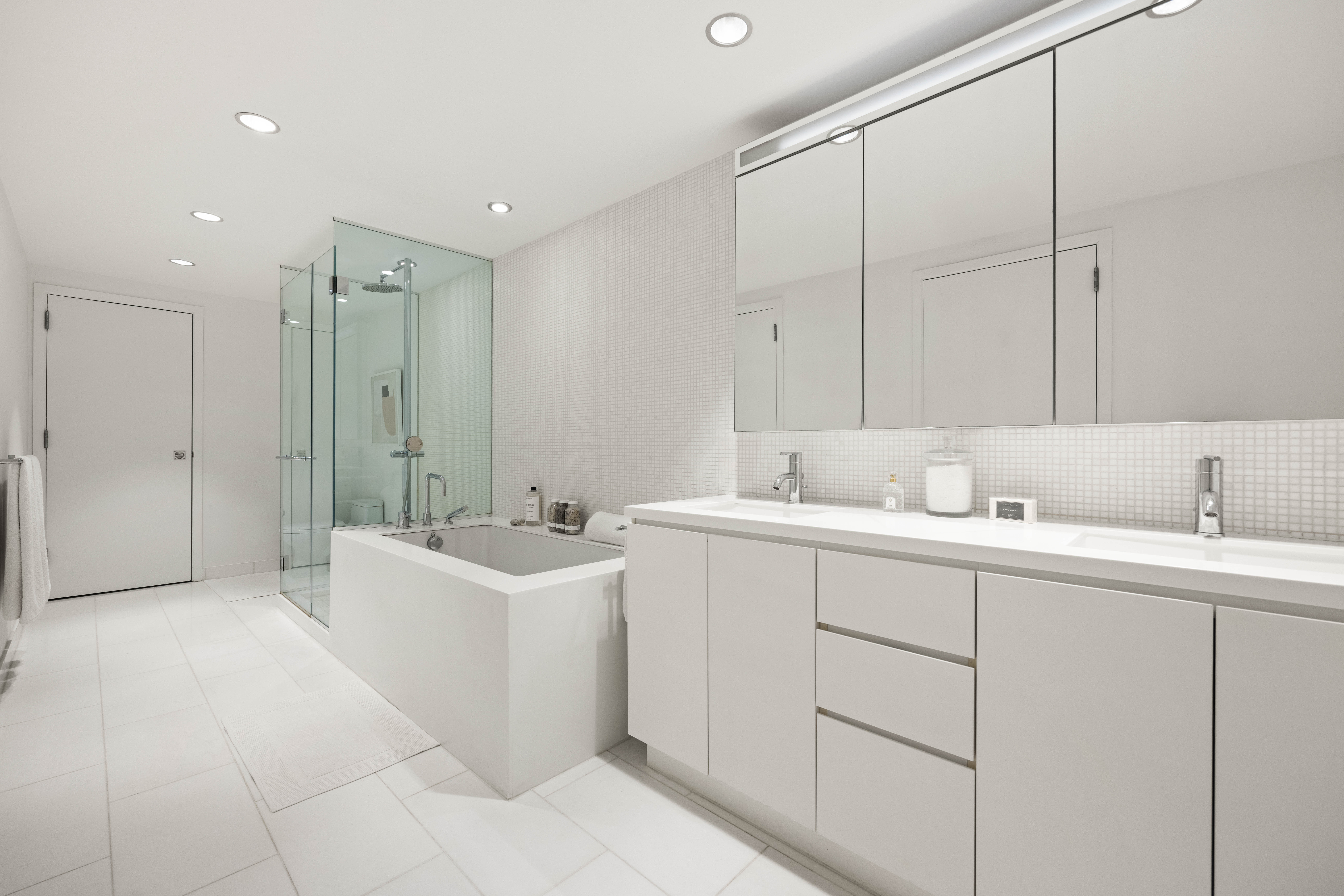 425 West 53rd Street, Unit 604 Manhattan, NY 10019 - Photo 8 of 12 a view of a sink and mirror