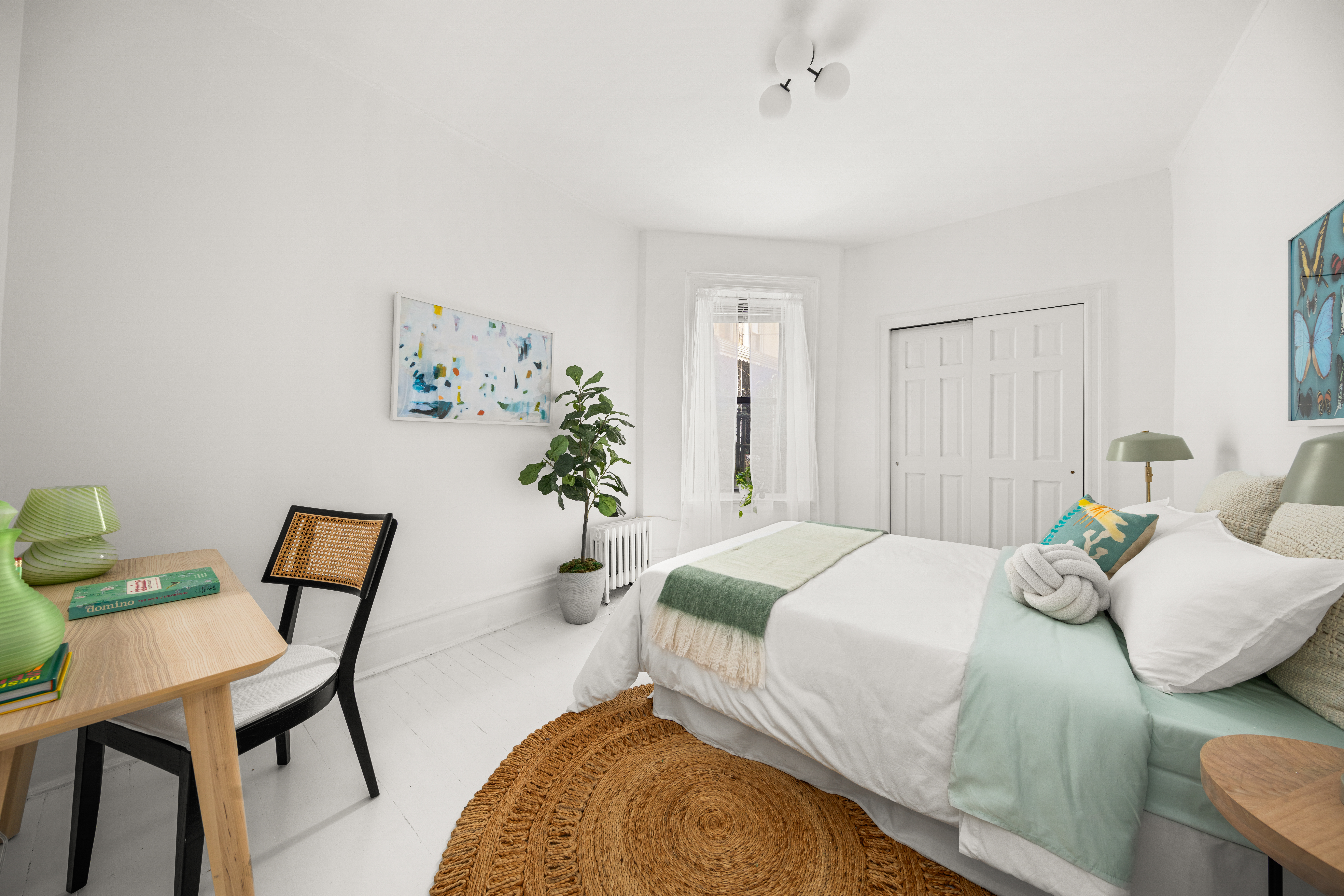 465 Eastern Parkway, Unit C Brooklyn, NY 11216 - Photo 7 of 12 a bedroom with a bed and chair