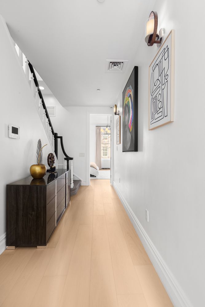 222 East 61st Street Manhattan, NY 10065 - Photo 14 of 28 a view of a hallway with windows