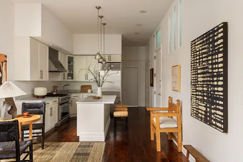 a kitchen with stainless steel appliances granite countertop a stove and refrigerator