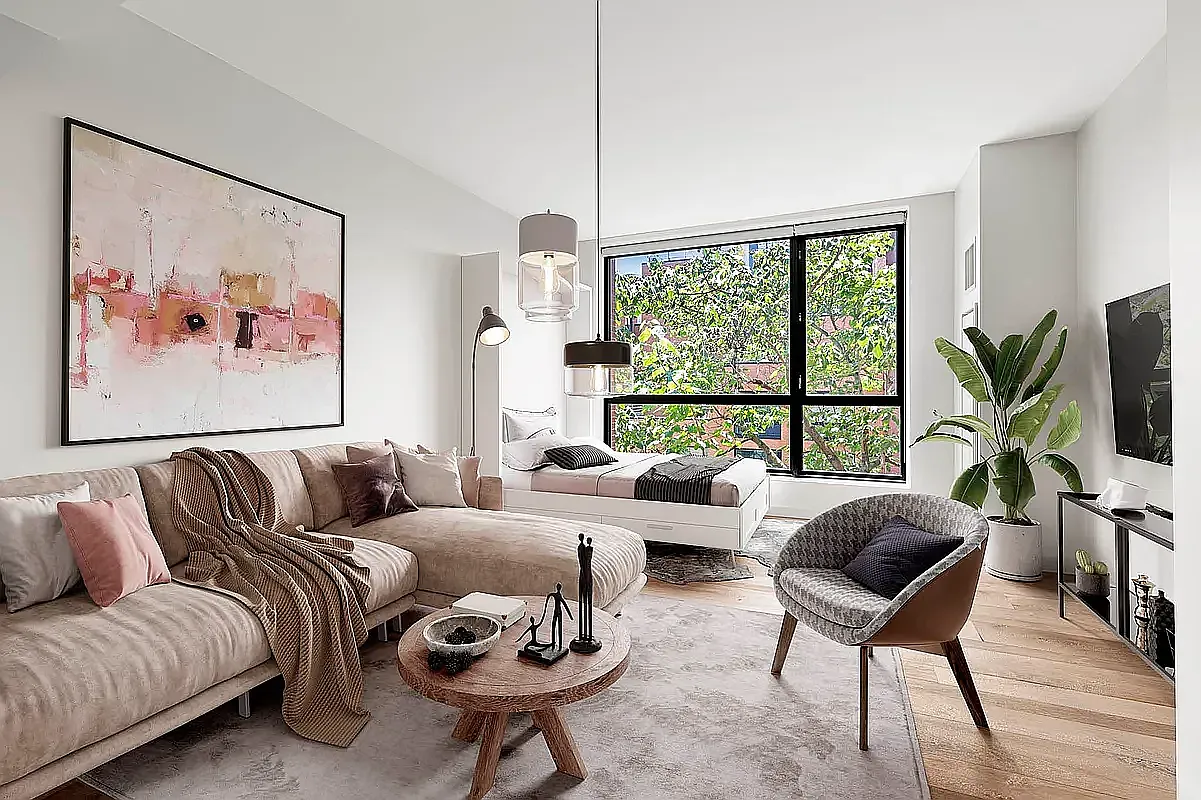 540 West 28th Street, Unit 8A Manhattan, NY 10001 - Photo 2 of 12 a living room with furniture and a large window