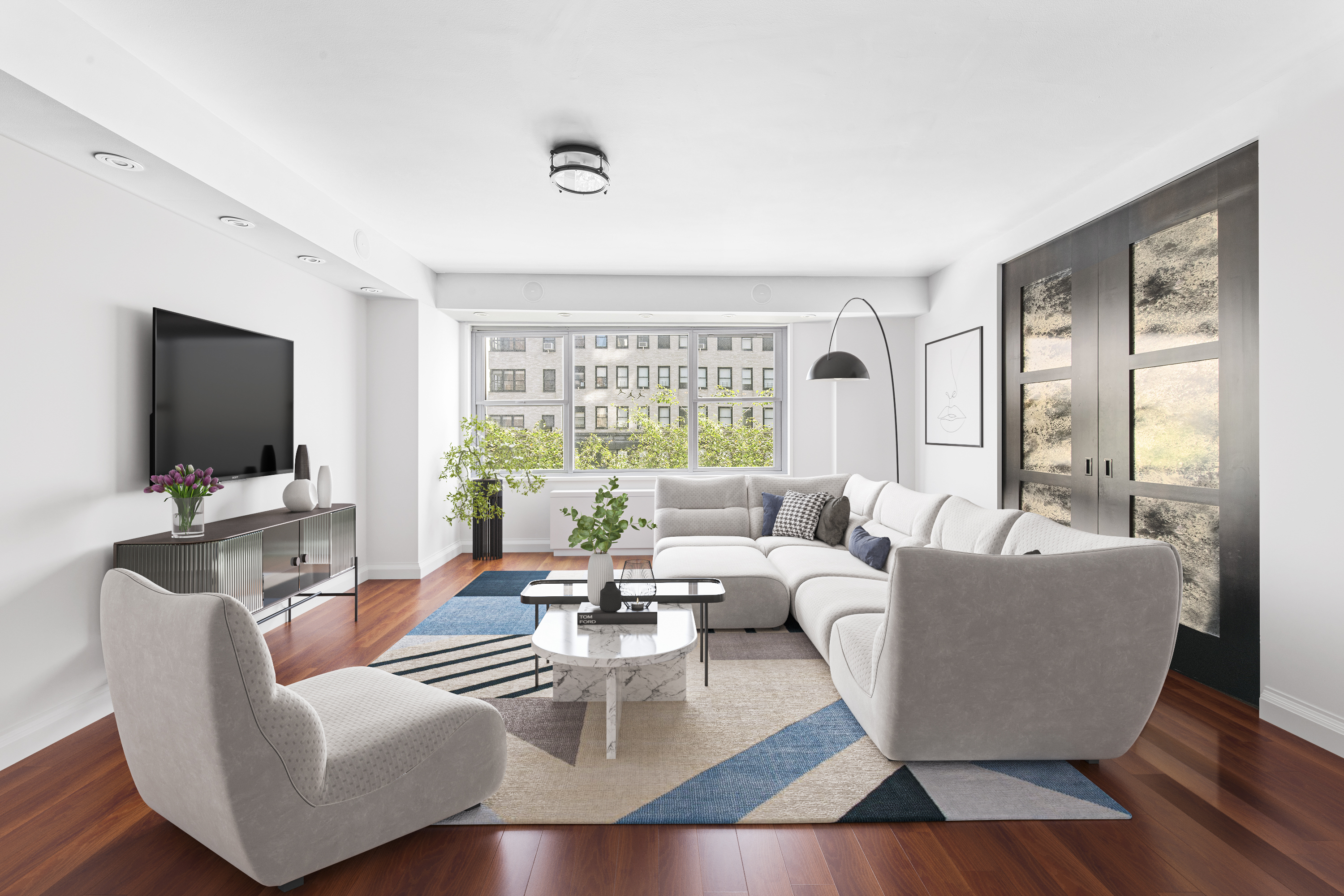 a living room with furniture and a flat screen tv