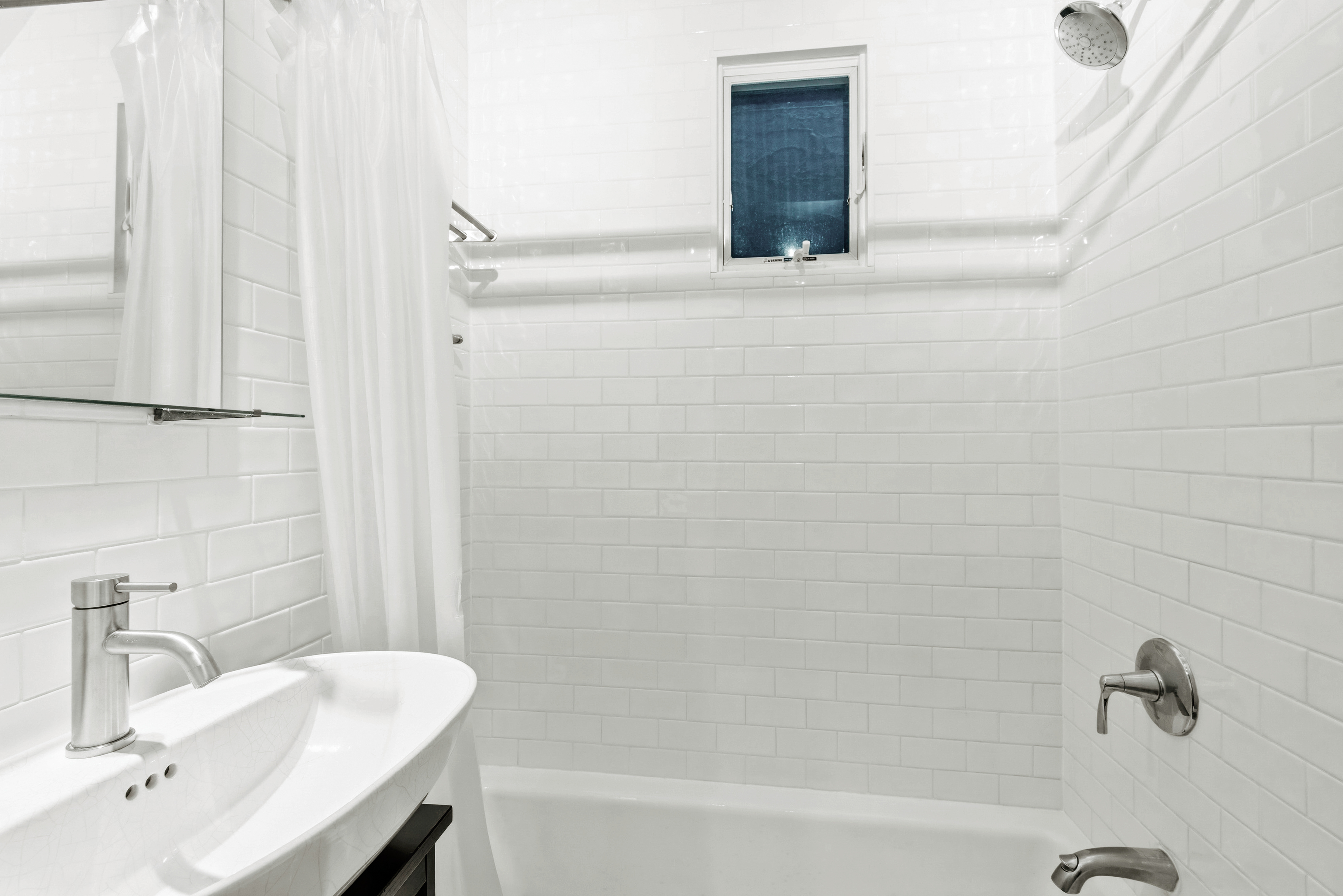 436 East 66th Street, Unit 4E Manhattan, NY 10065 - Photo 6 of 19 a bathroom with a sink and a mirror