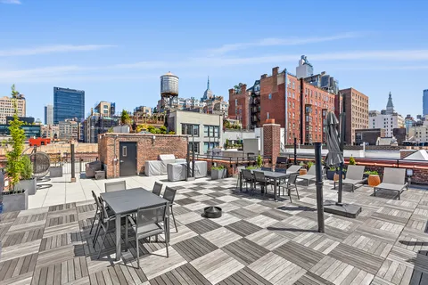 a outdoor space with lots of tables a chairs and a couch