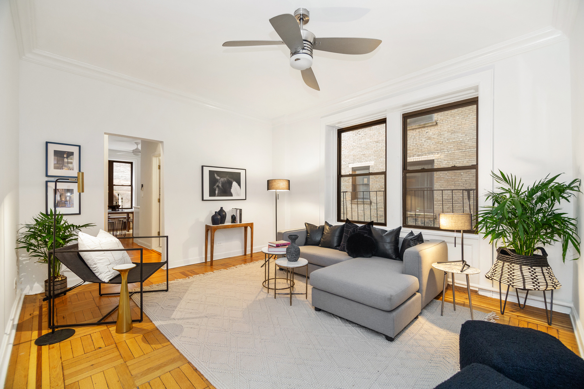 790 Riverside Drive, Unit 1S Manhattan, NY 10032 - Photo 1 of 20 a living room with furniture and a window