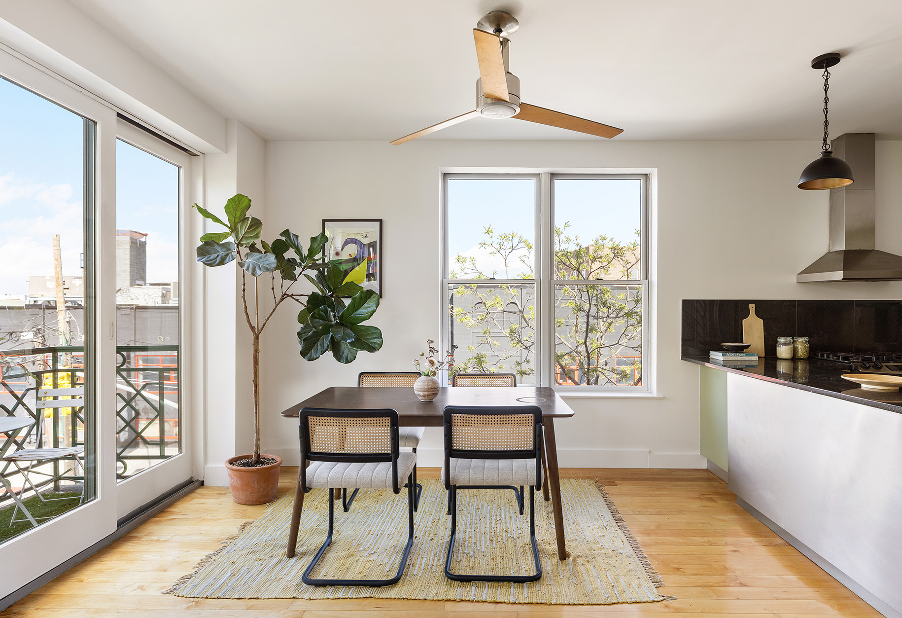 258 Richardson Street, Unit 3L Brooklyn, NY 11222 - Photo 4 of 11 a dining room with furniture a chandelier and wooden floor