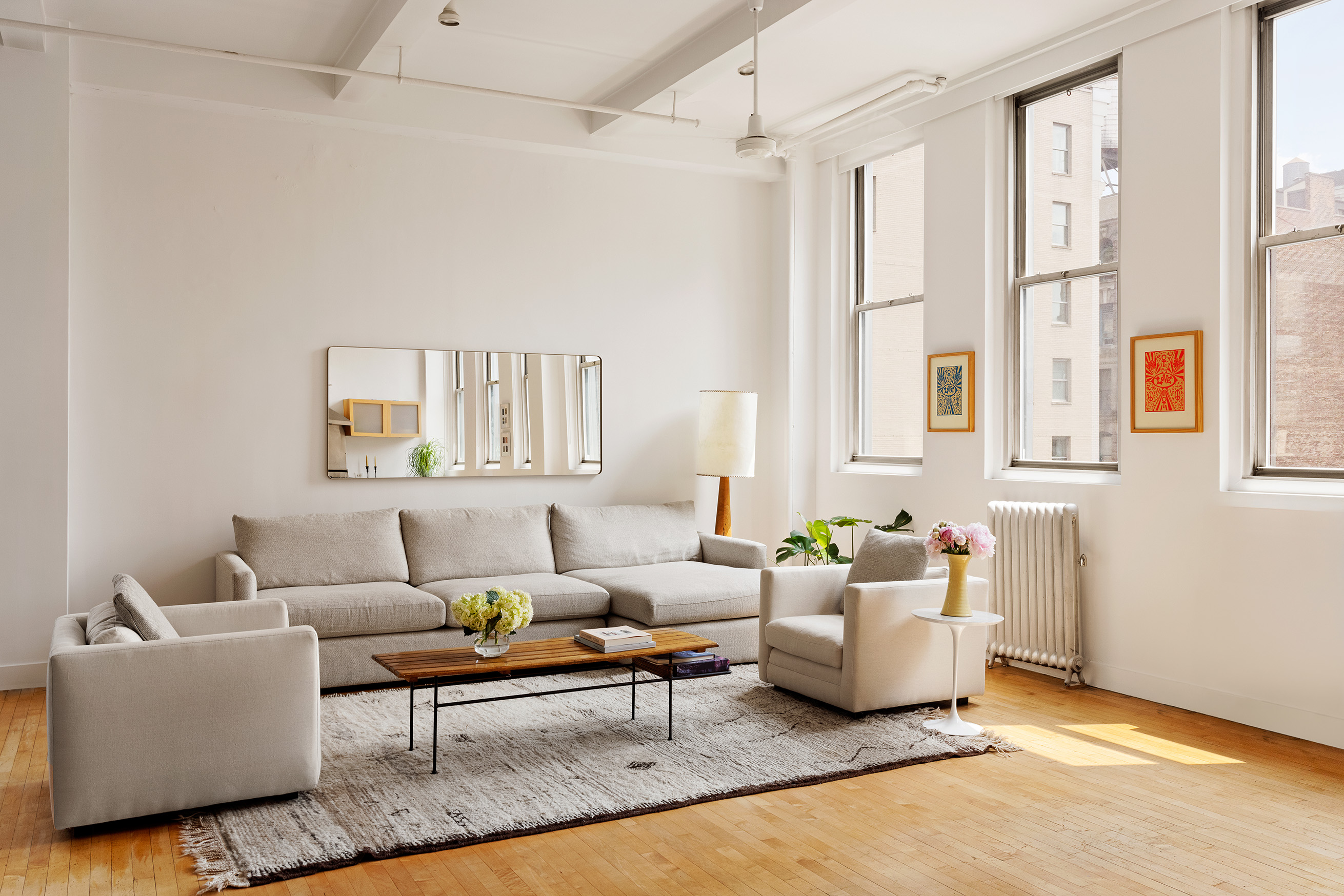 32 West 20th Street, Unit 9B Manhattan, NY 10011 - Photo 5 of 16 a living room with furniture and a large window