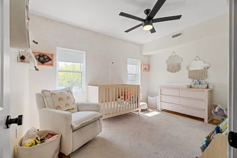 a bedroom with furniture and a window