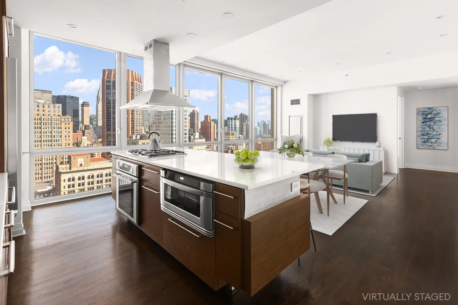 a kitchen with stainless steel appliances kitchen island granite countertop a stove and a view of living room