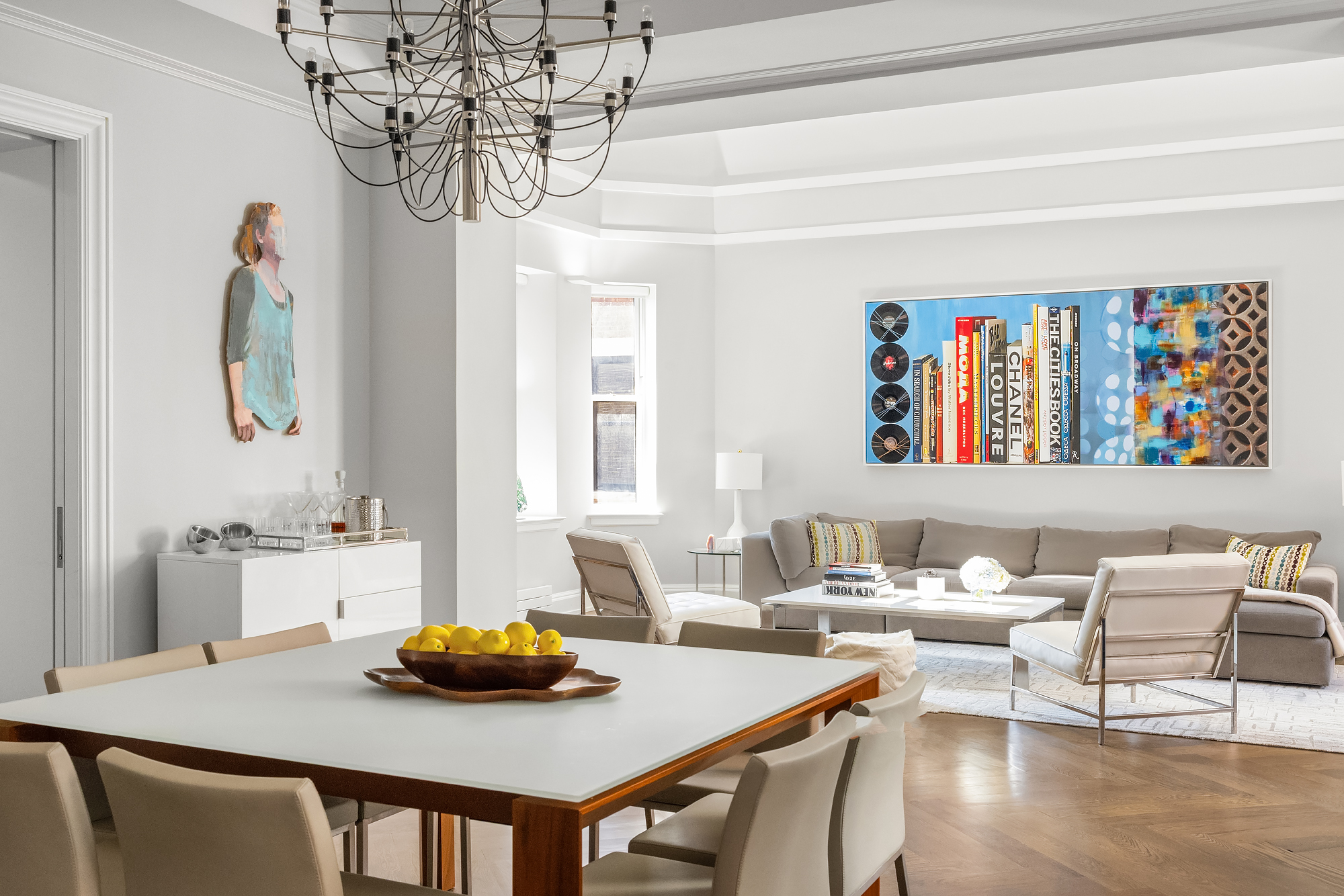 344 West 72nd Street, Unit 1007 Manhattan, NY 10023 - Photo 8 of 23 a view of a dining room with furniture a chandelier and wooden floor