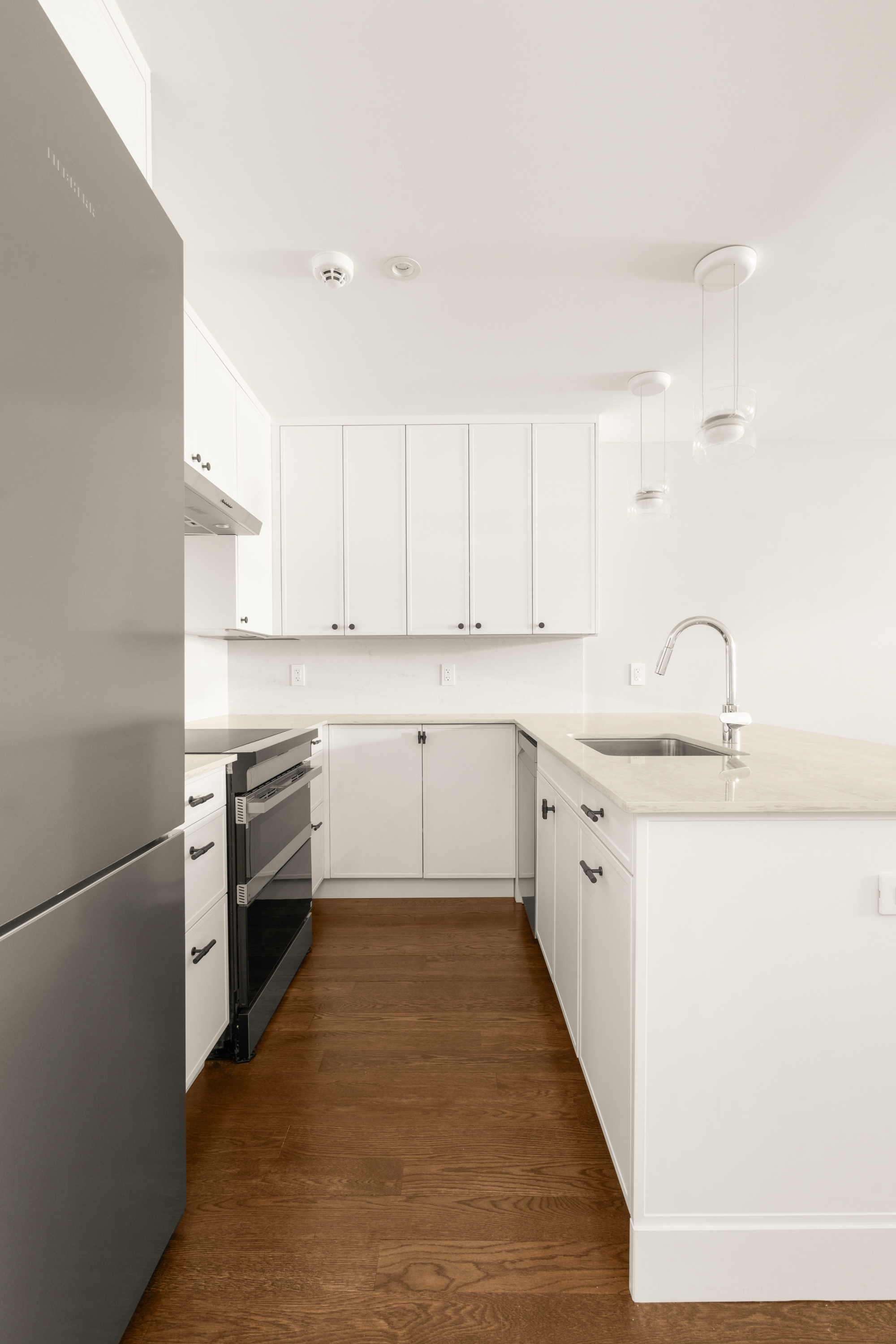 150 Henry Street, Unit GARDEN Brooklyn, NY 11201 - Photo 3 of 8 a kitchen with stainless steel appliances granite countertop a sink stove and refrigerator