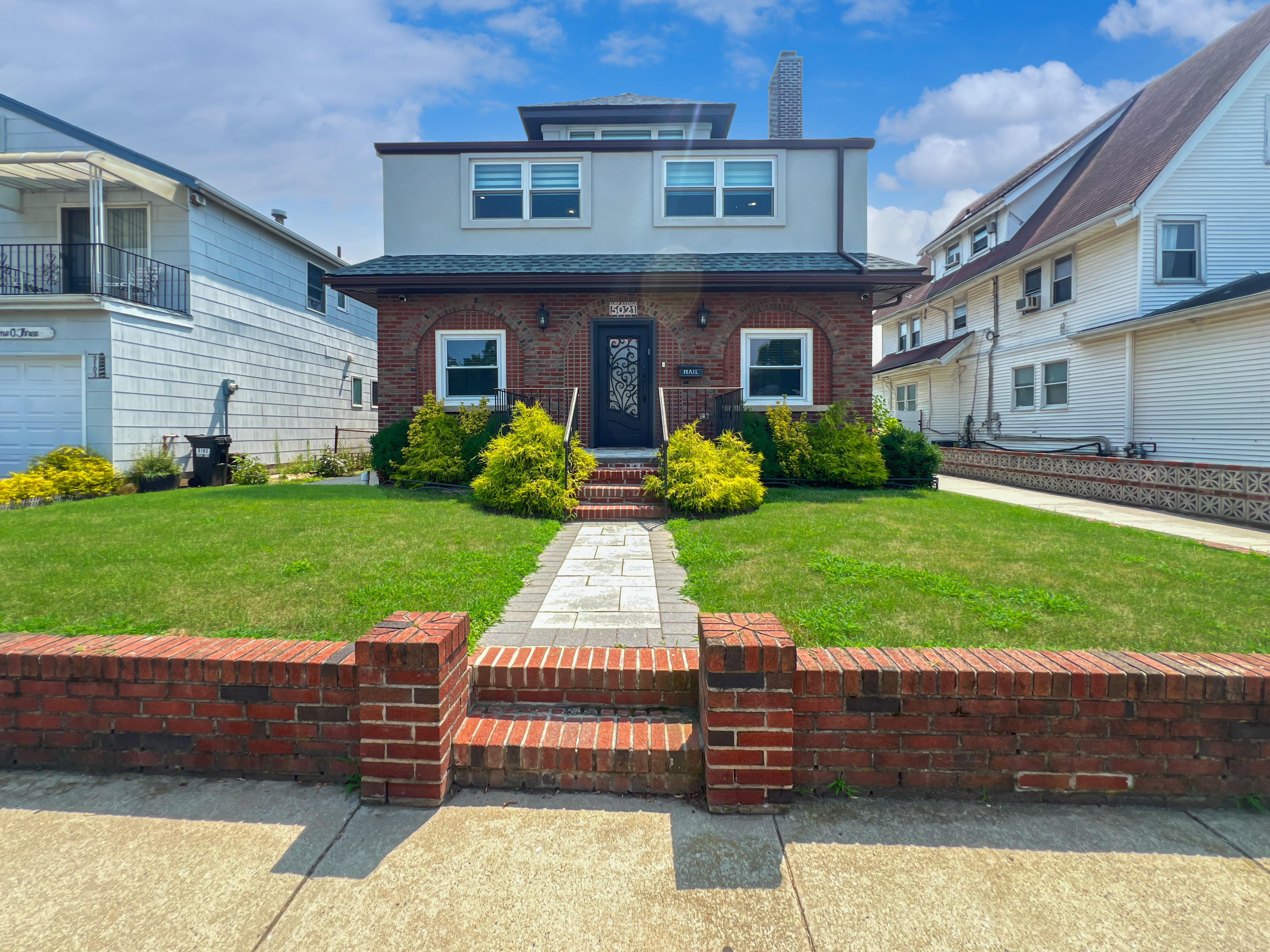 5021 Surf Avenue Brooklyn, NY 11224 - Photo 26 of 32 a front view of a house with garden