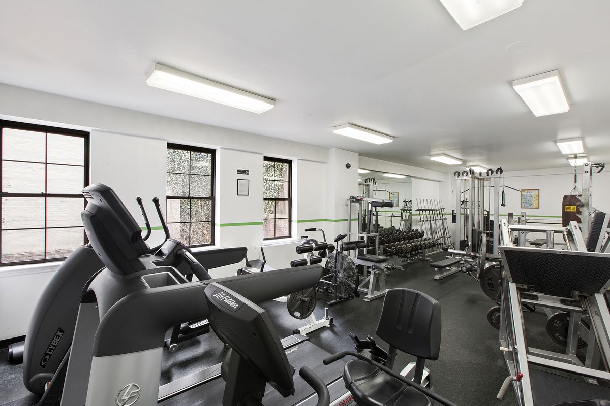 222 West 14th Street, Unit 5D Manhattan, NY 10011 - Photo 6 of 9 a room with gym equipment and a view of living room