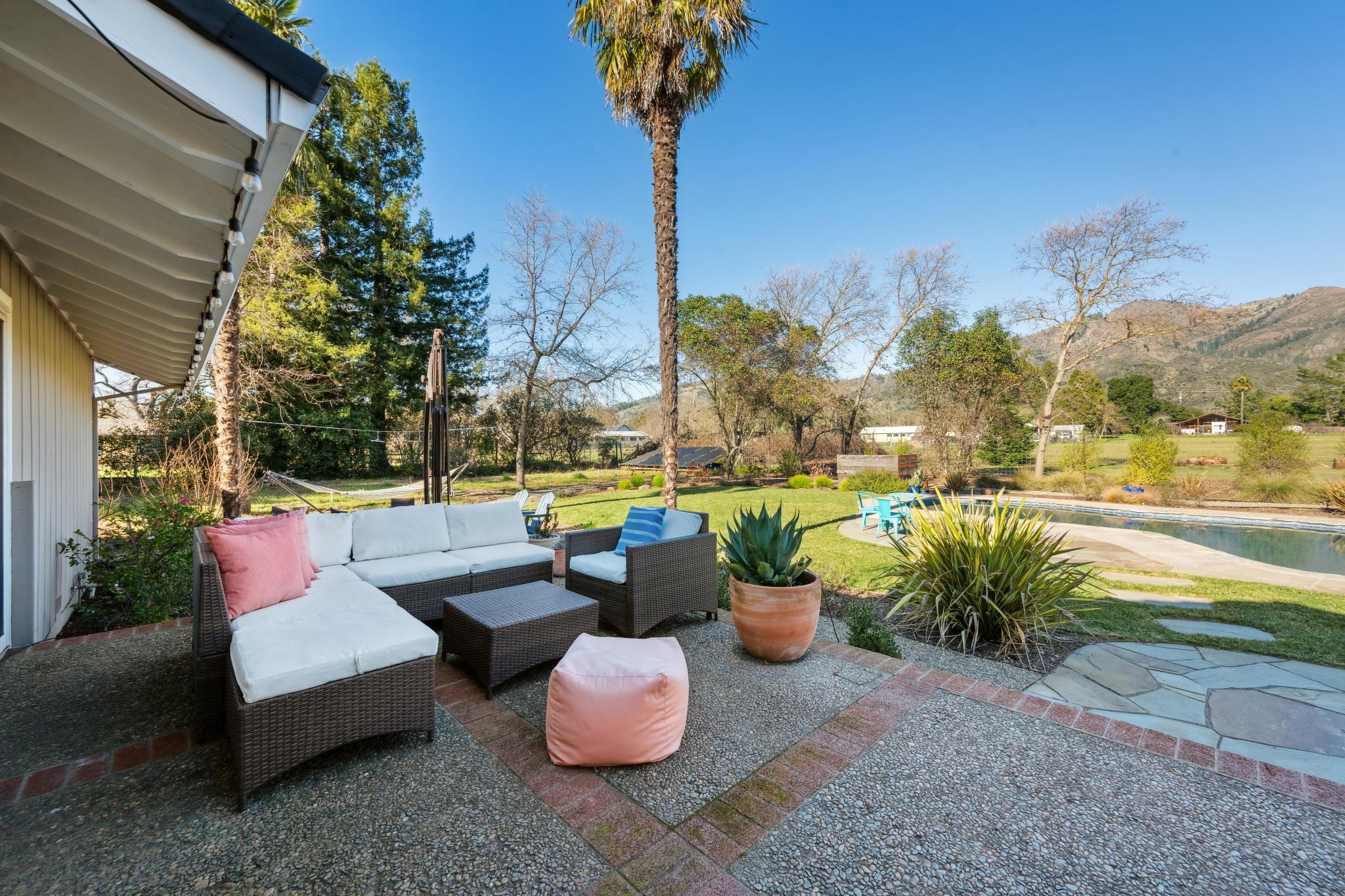 123 Frey Road Santa Rosa, CA 95409 - Photo 60 of 62 a view of a patio with couches table and chairs and potted plants