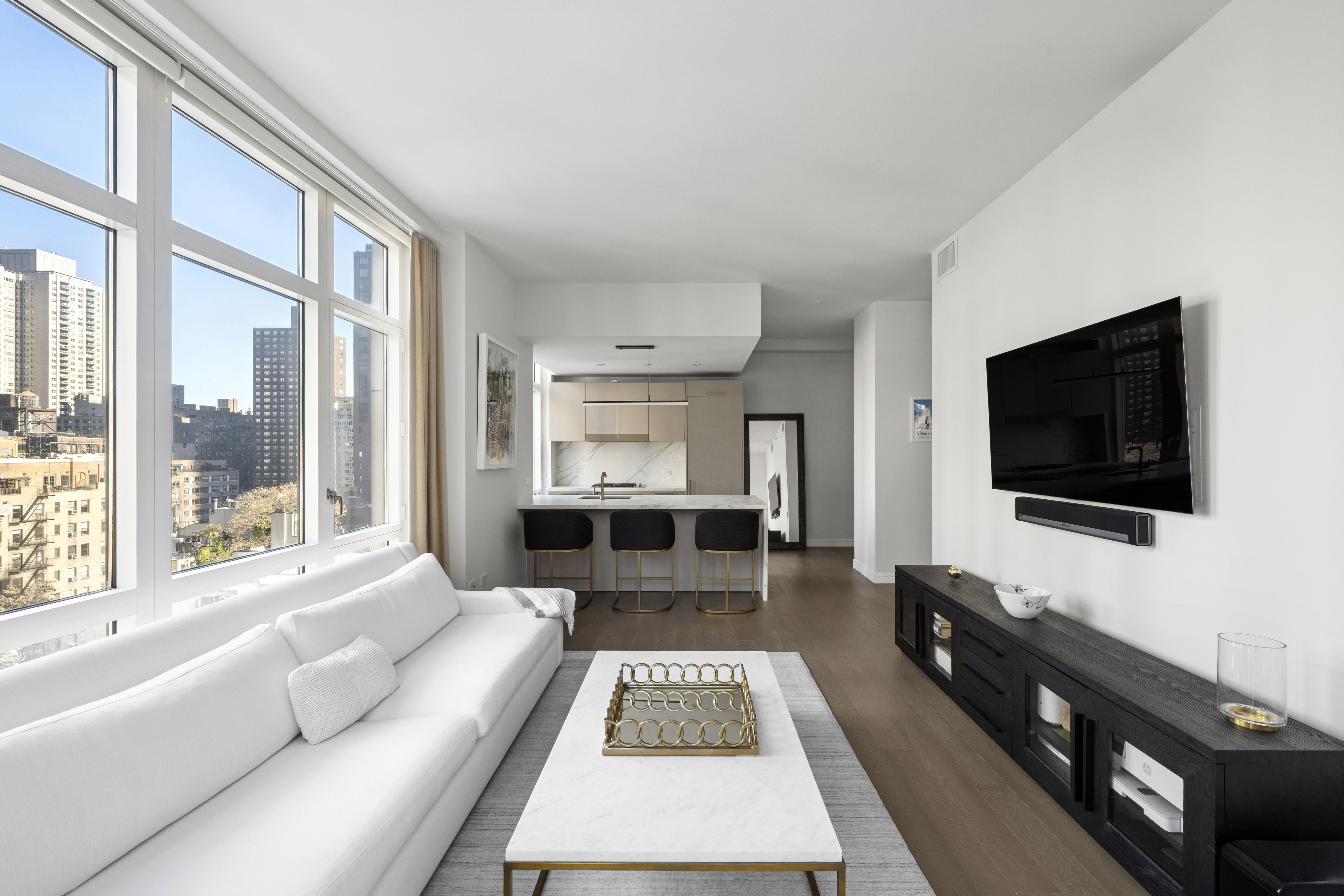 305 East 51st Street, Unit 11D Manhattan, NY 10022 - Photo 3 of 18 a living room with furniture and a flat screen tv