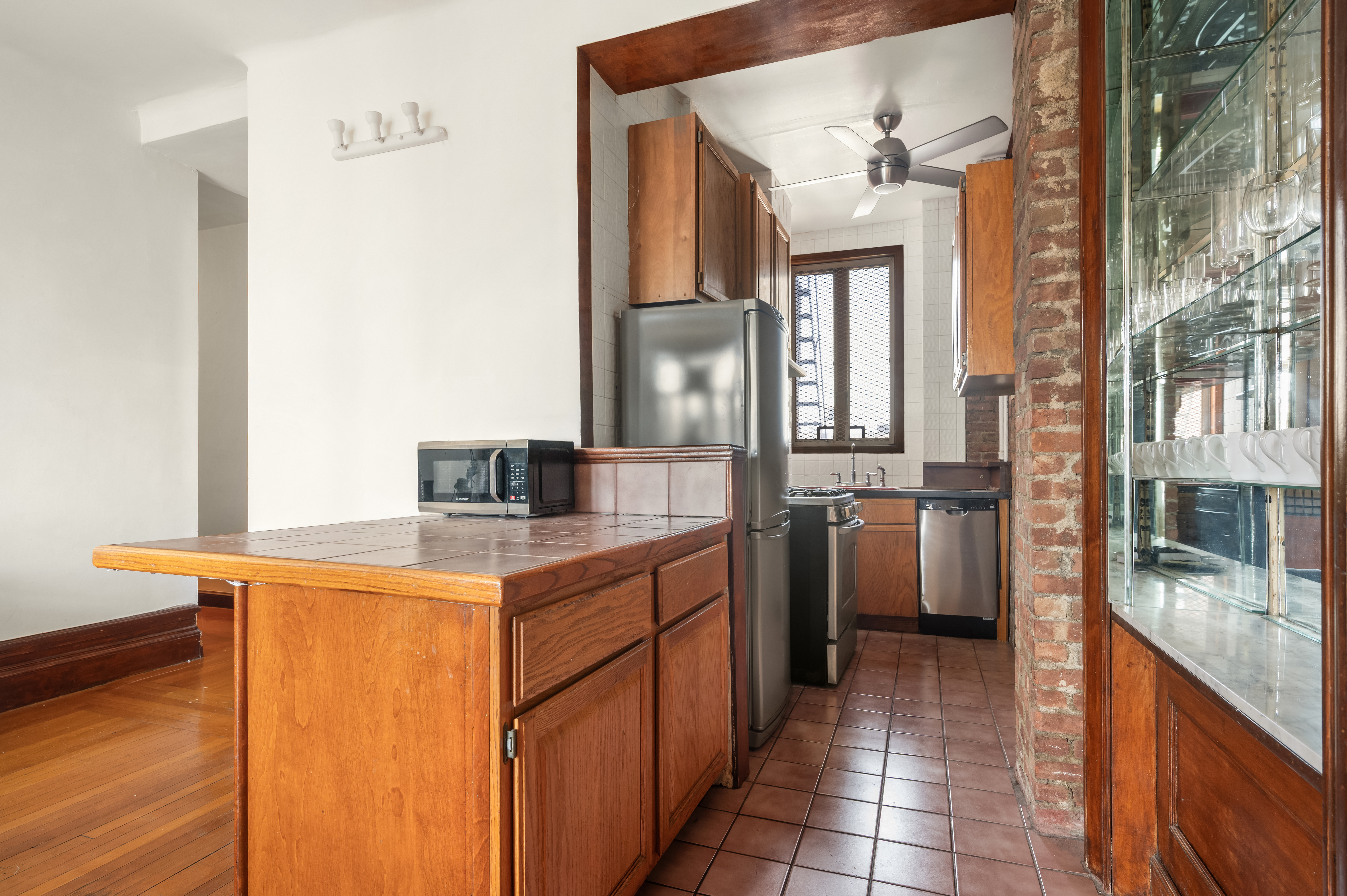 504-510 West 110th Street, Unit 12E Manhattan, NY 10025 - Photo 2 of 6 a kitchen with a sink and cabinets