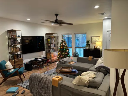 a living room with furniture and a flat screen tv