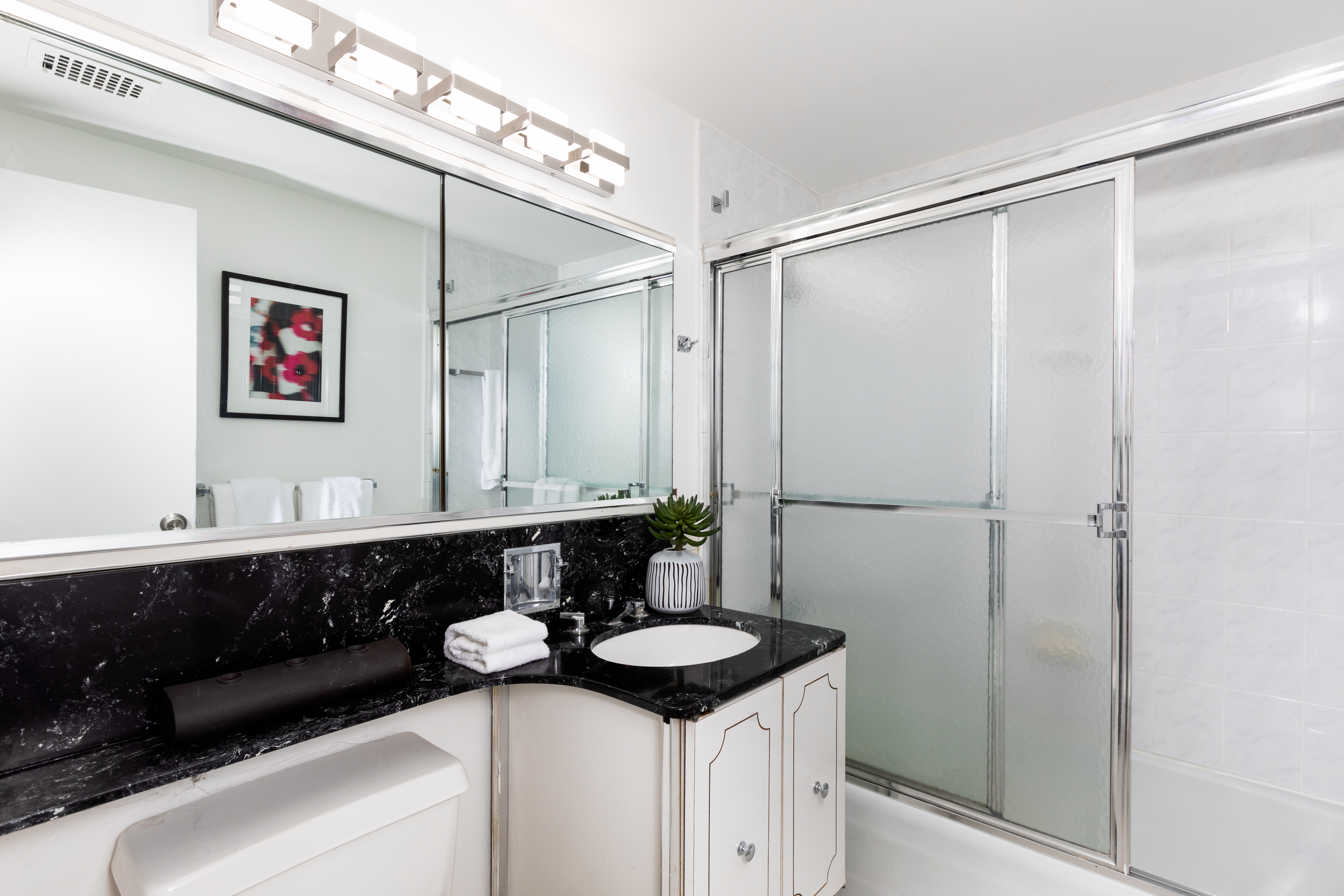 80 Central Park West, Unit 12C Manhattan, NY 10023 - Photo 17 of 27 a bathroom with a sink and a mirror