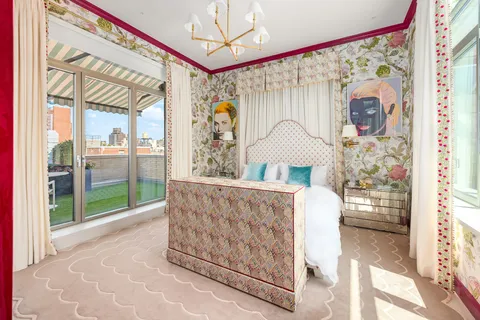 a living room with a large window and a table