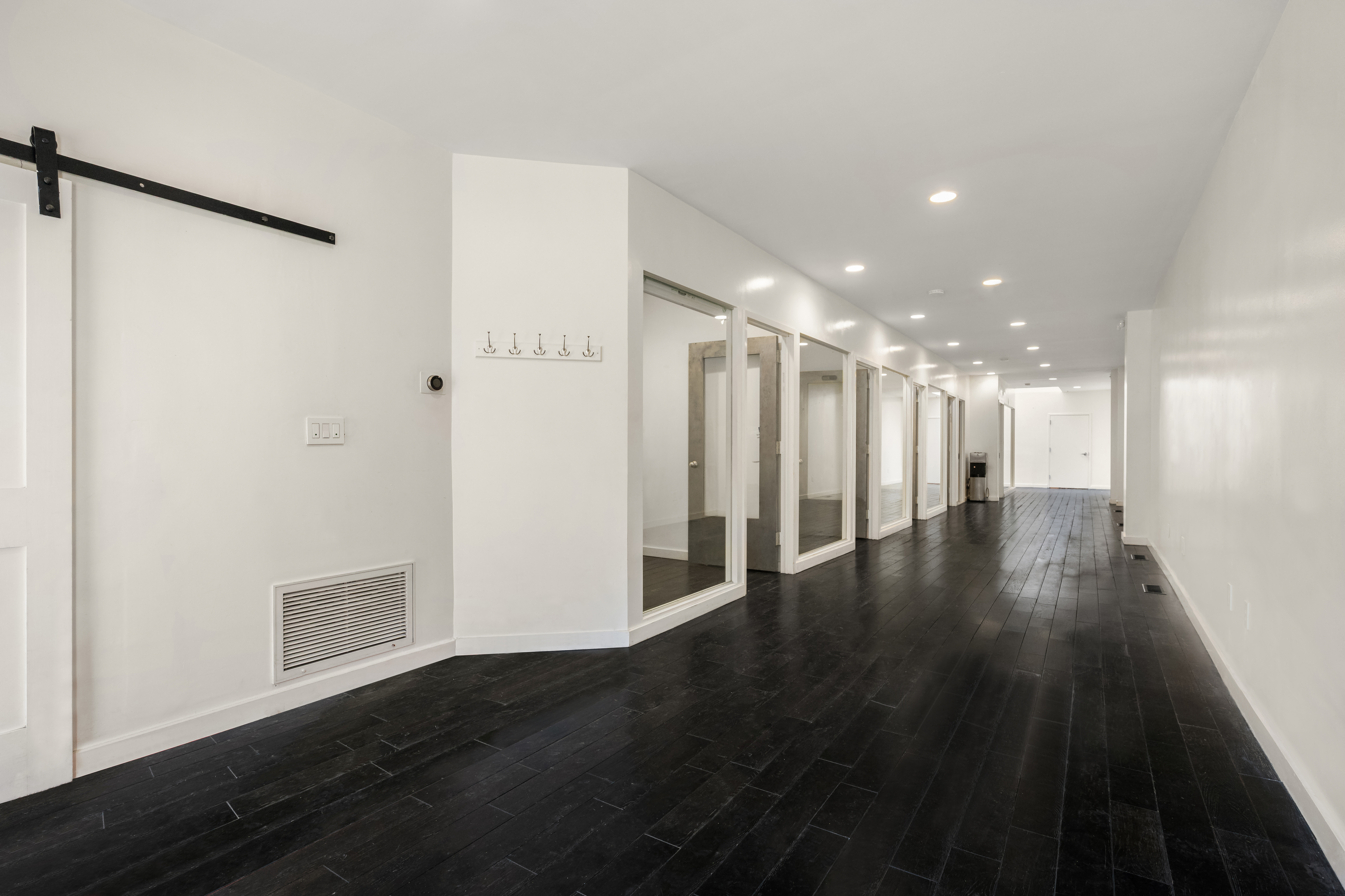 273 Lenox Avenue Manhattan, NY 10027 - Photo 8 of 15 a view of a hallway with wooden floor