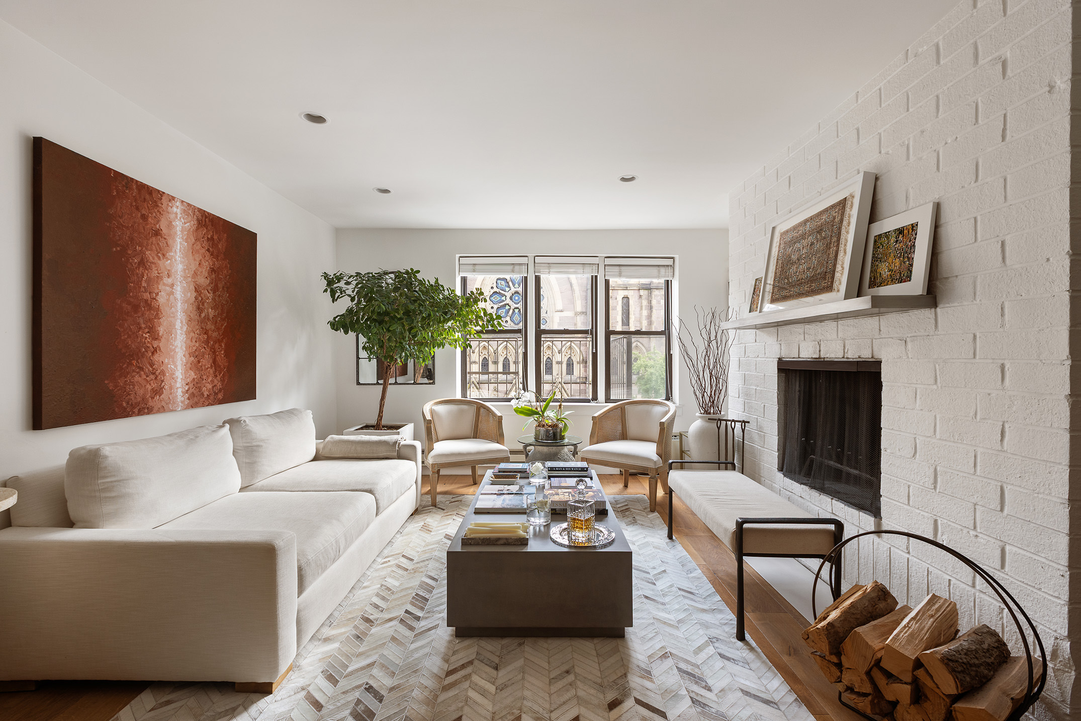 a living room with furniture fireplace and flat screen tv