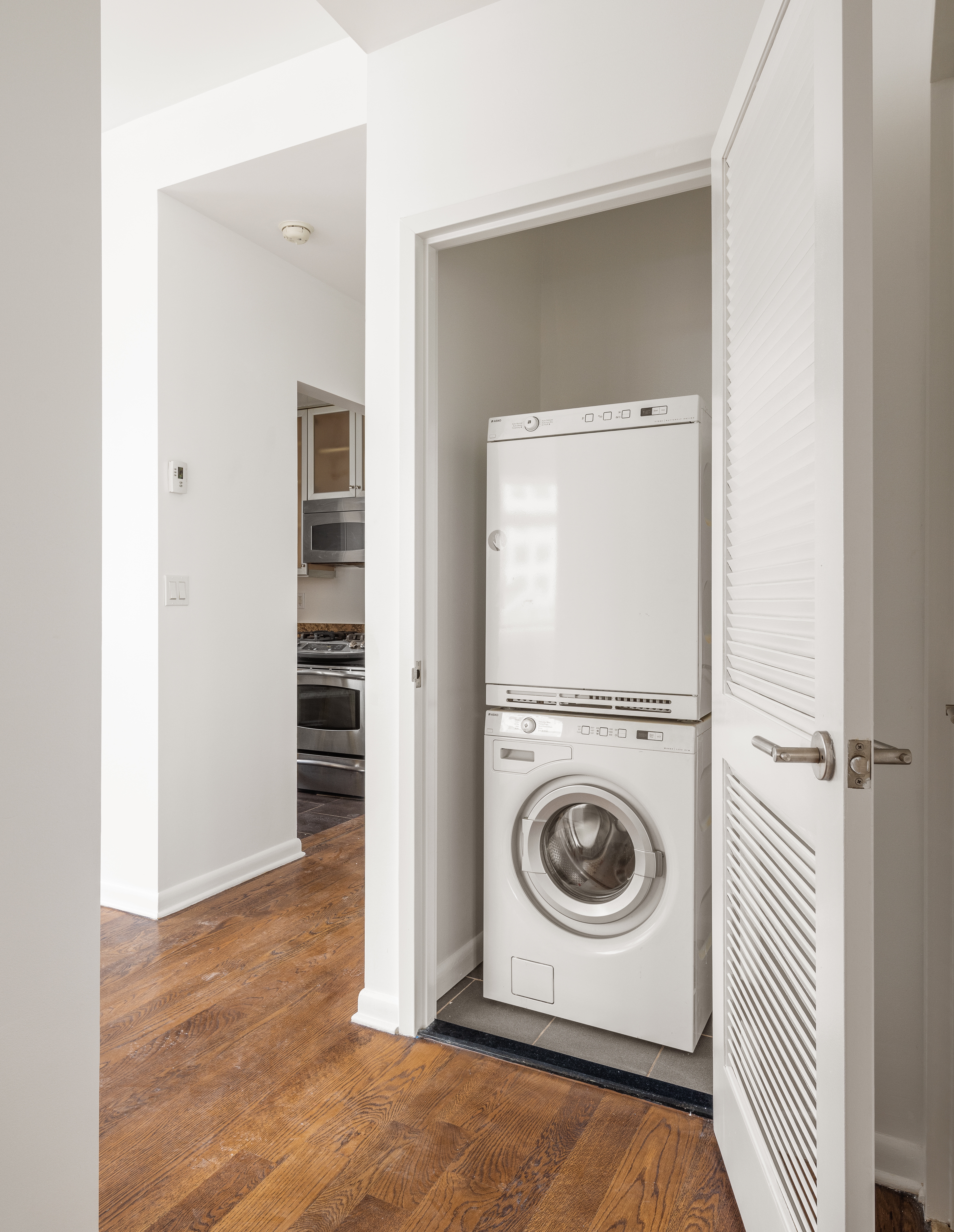 2279 3rd Avenue, Unit 6B Manhattan, NY 10035 - Photo 6 of 10 a view of a hallway with washer and dryer
