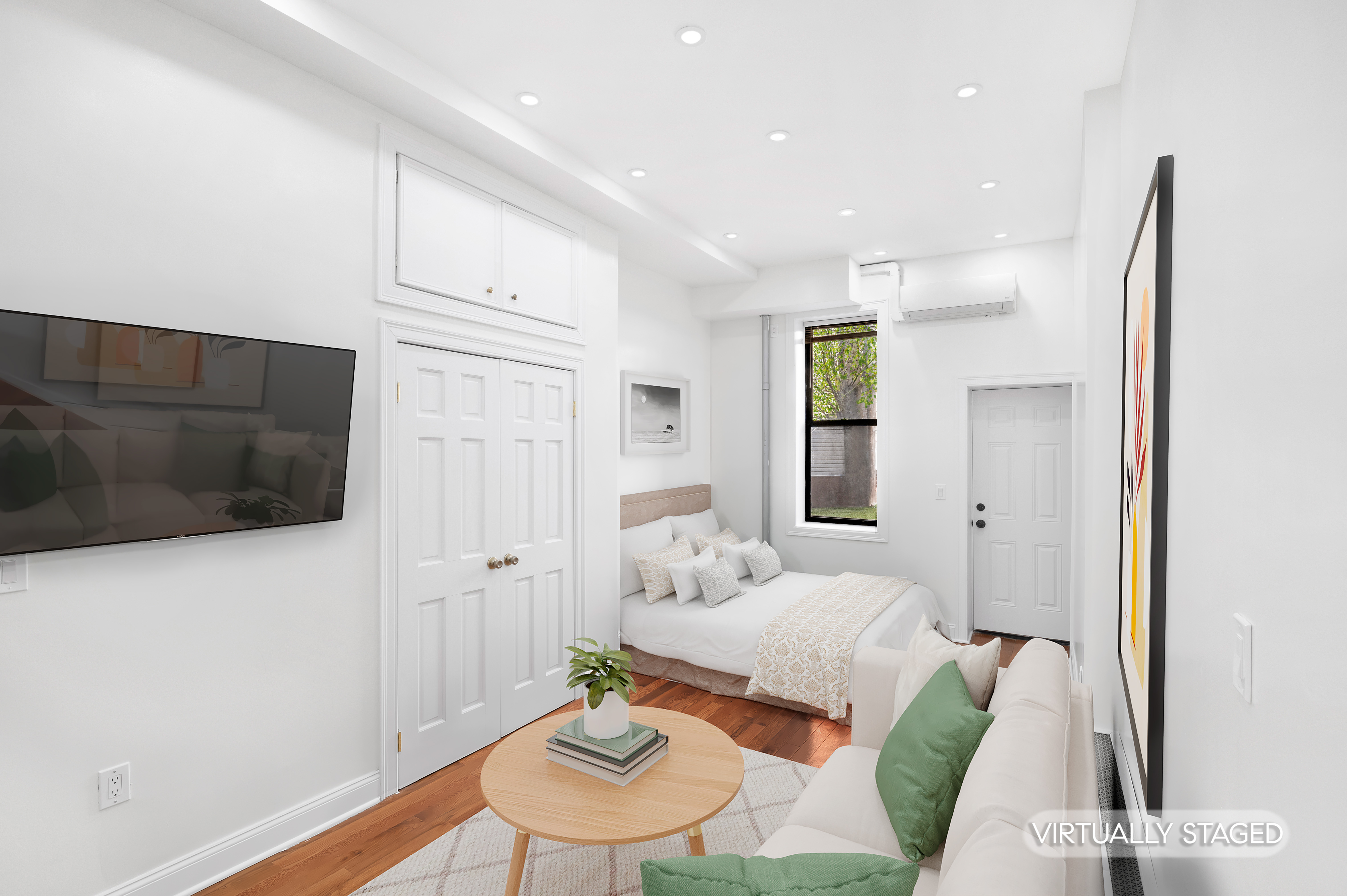 181 Knickerbocker Avenue, Unit 1R Brooklyn, NY 11237 - Photo 2 of 4 a living room with furniture and a flat screen tv