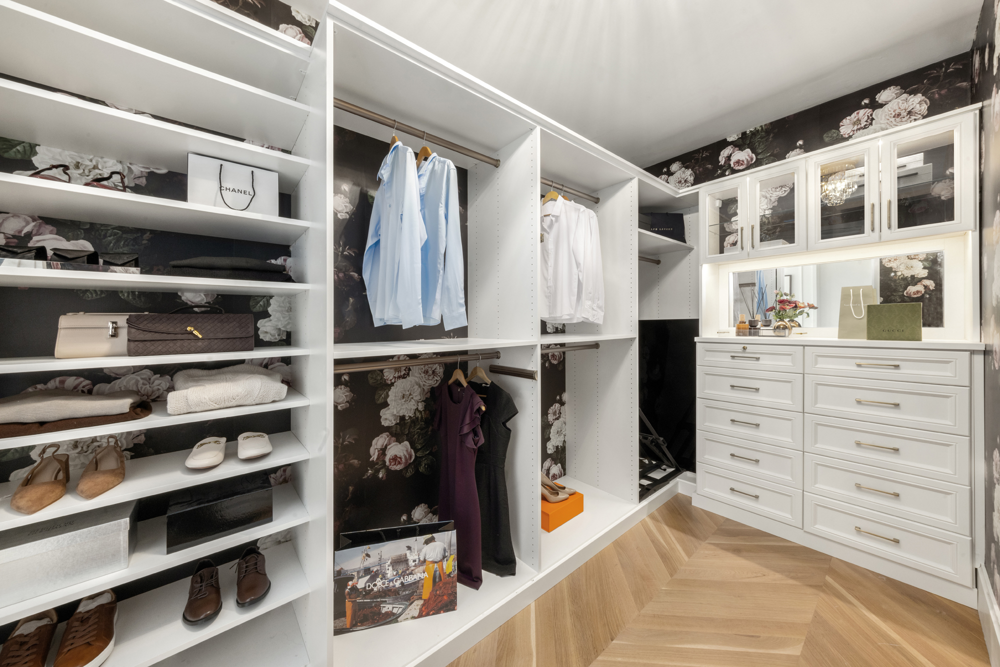 217 West 57th Street, Unit 34F Manhattan, NY 10019 - Photo 9 of 25 a view of walk in closet with clothes and shoes