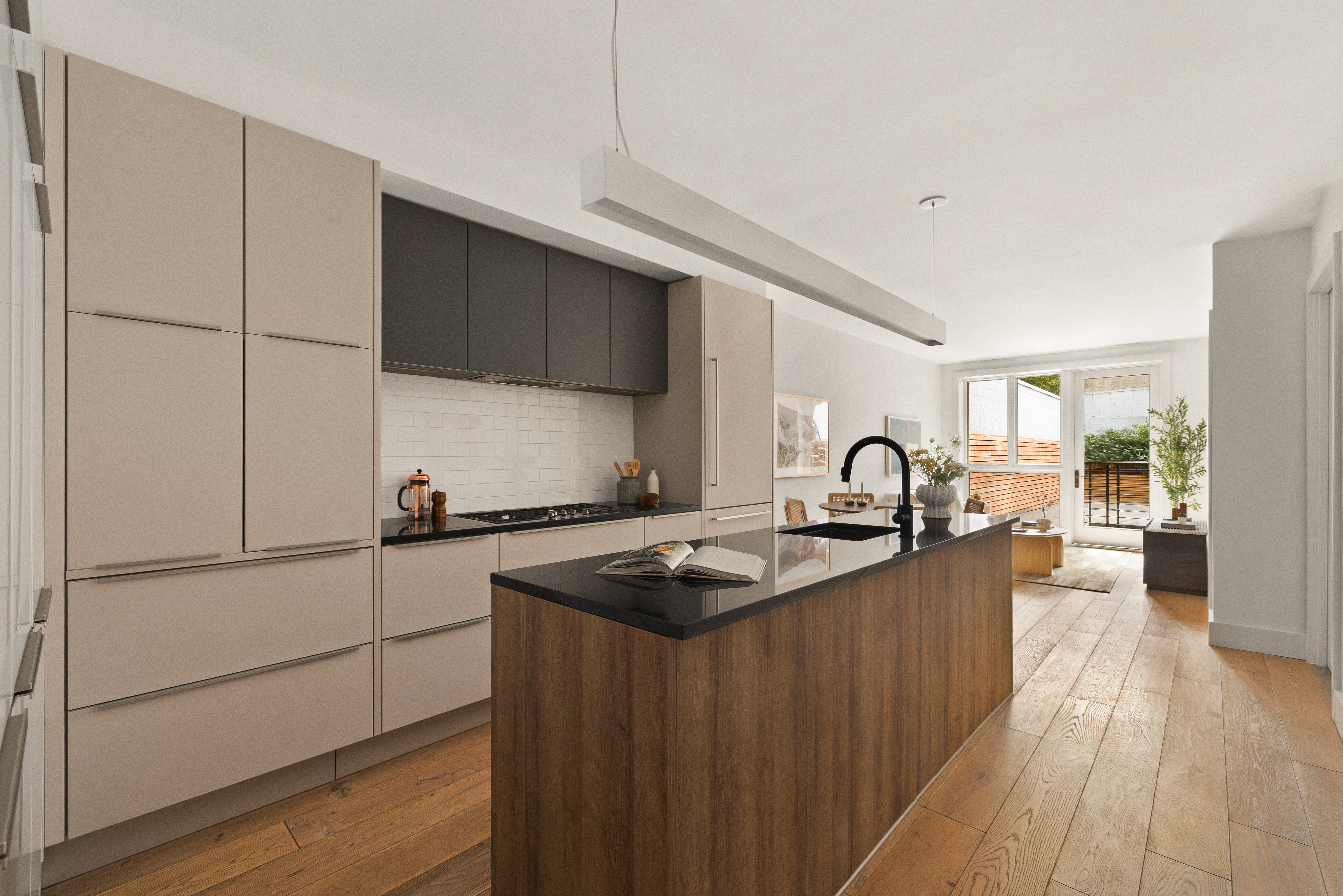 a kitchen with granite countertop a sink stove and refrigerator