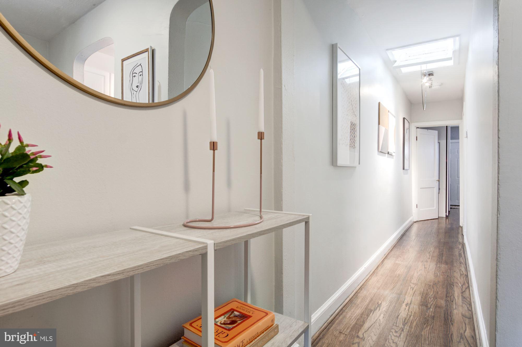 731 13th Street Northeast Washington, DC 20002 - Photo 20 of 43 a view of a livingroom with wooden floor and a hallway