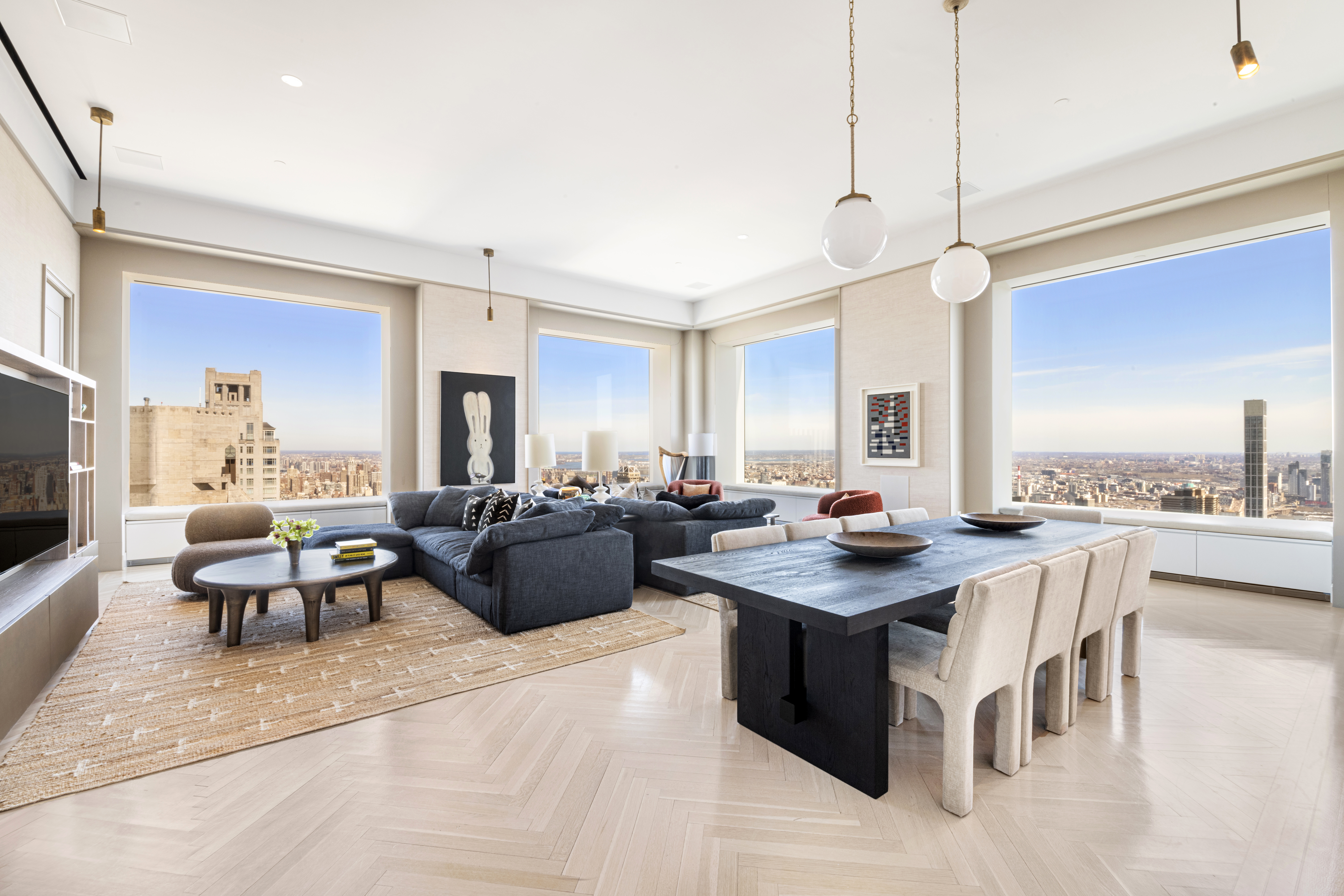 a living room with granite countertop furniture a fireplace and a flat screen tv