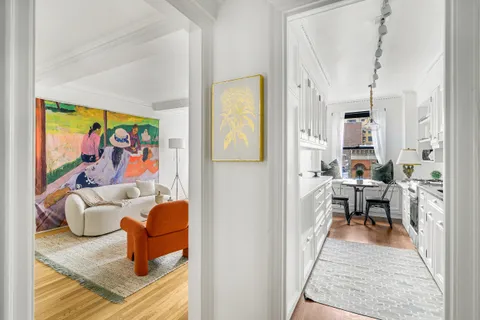 a lobby with furniture and rug