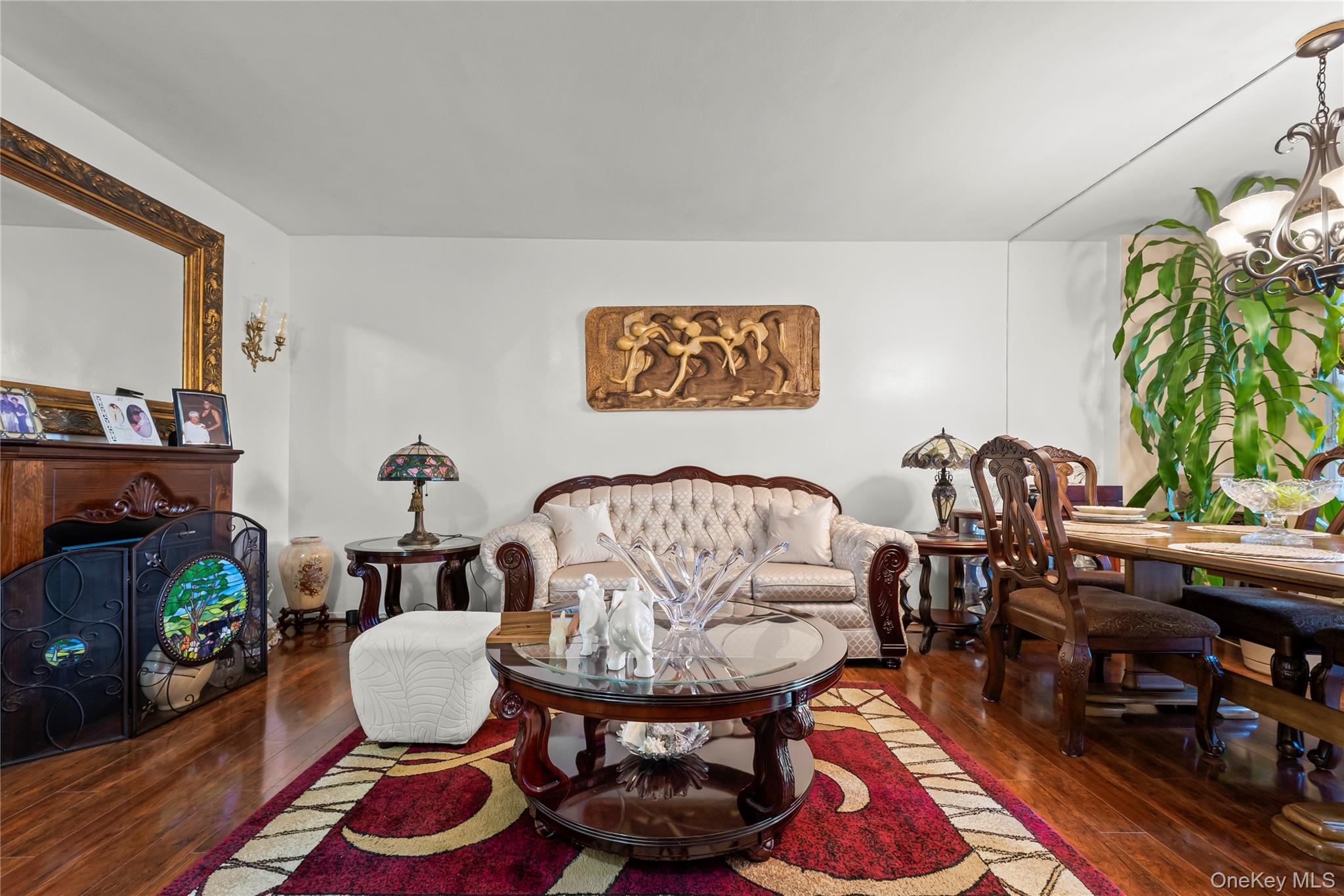 12399 Flatlands Avenue, Unit 1L Brooklyn, NY 11207 - Photo 2 of 21 a living room with furniture and a rug