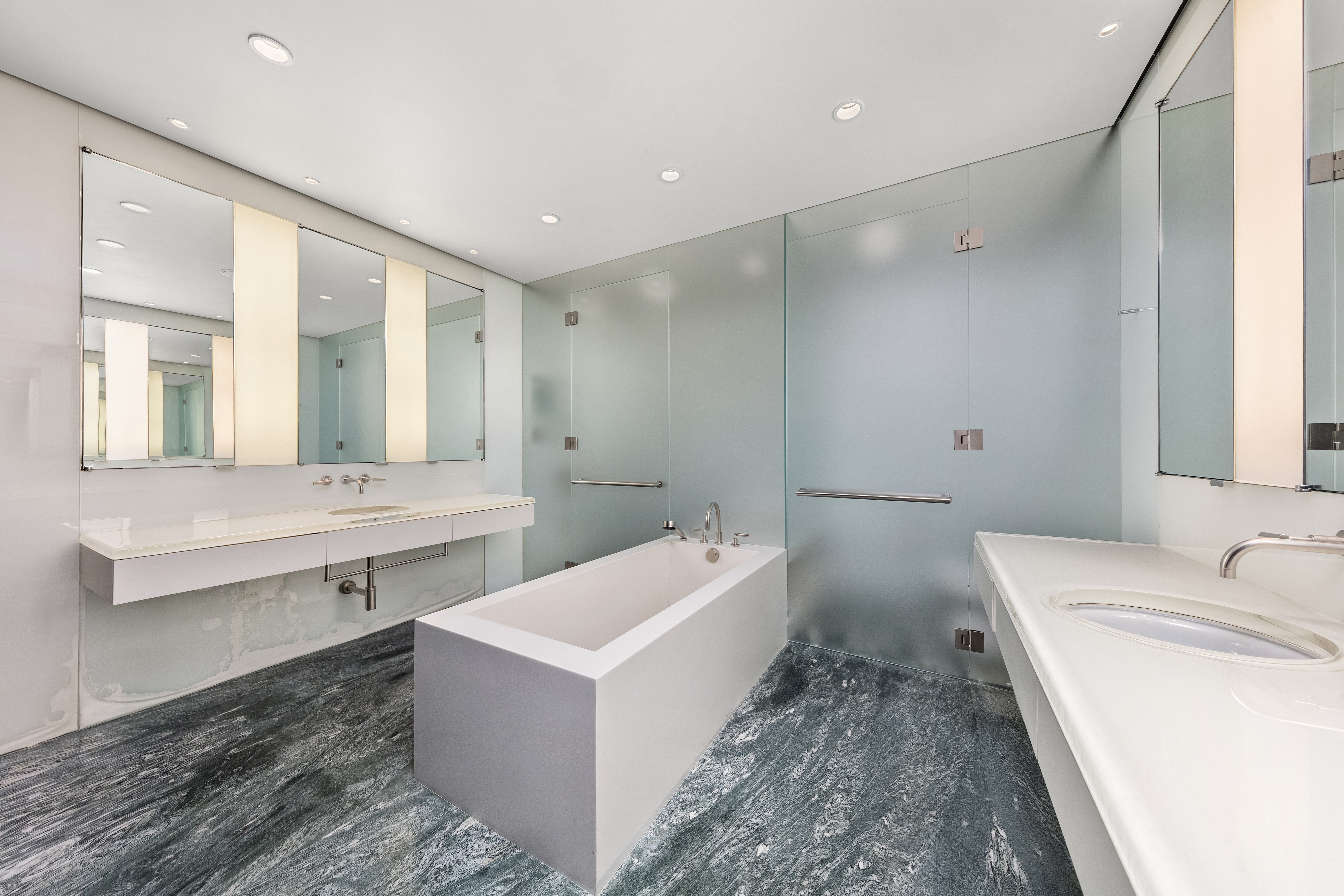 55 Hudson Street, Unit 3BCD Manhattan, NY 10013 - Photo 14 of 21 a bathroom with a sink and a mirror