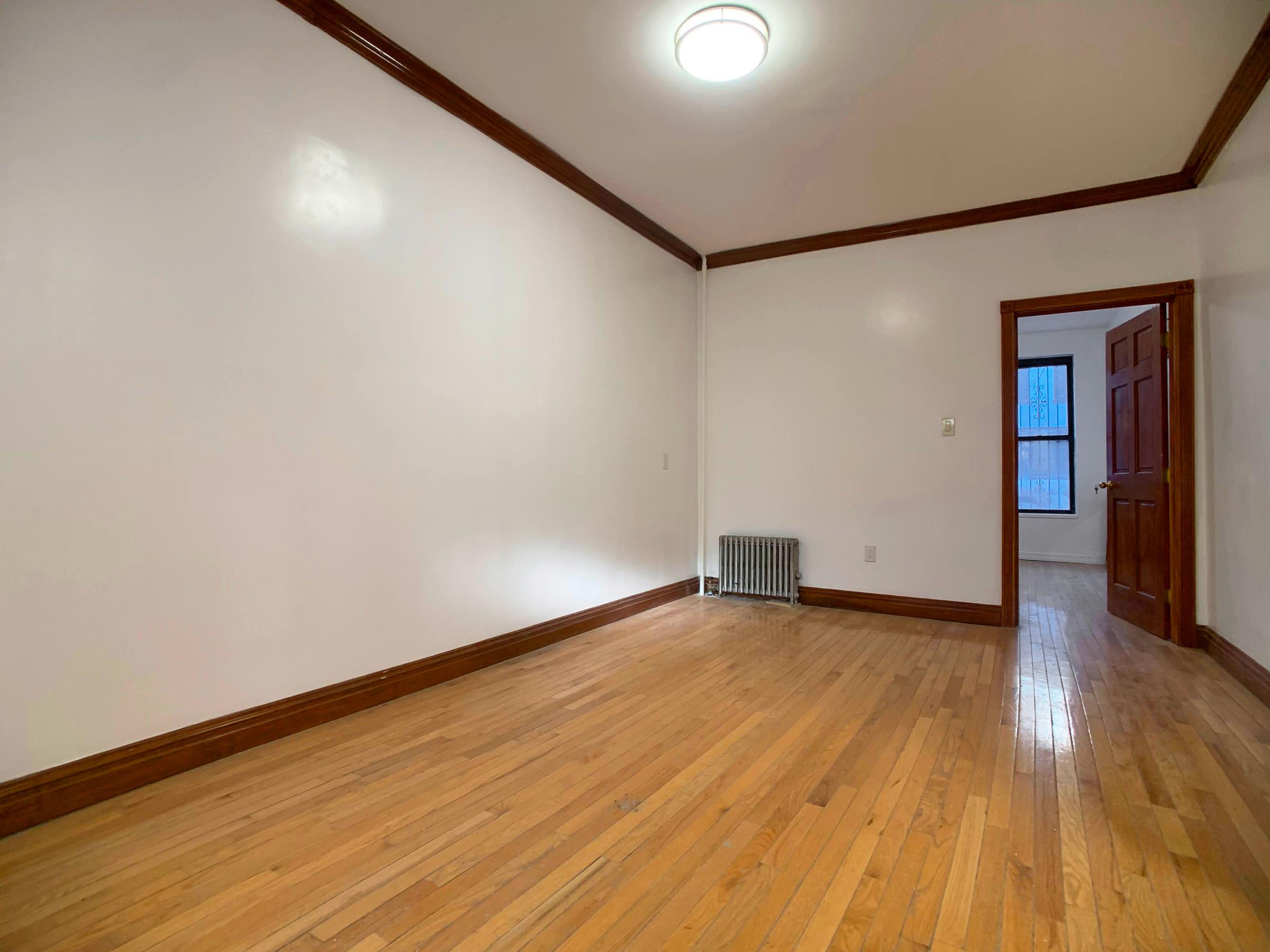 630 President Street, Unit 1 Brooklyn, NY 11215 - Photo 3 of 11 a view of an empty room with wooden floor