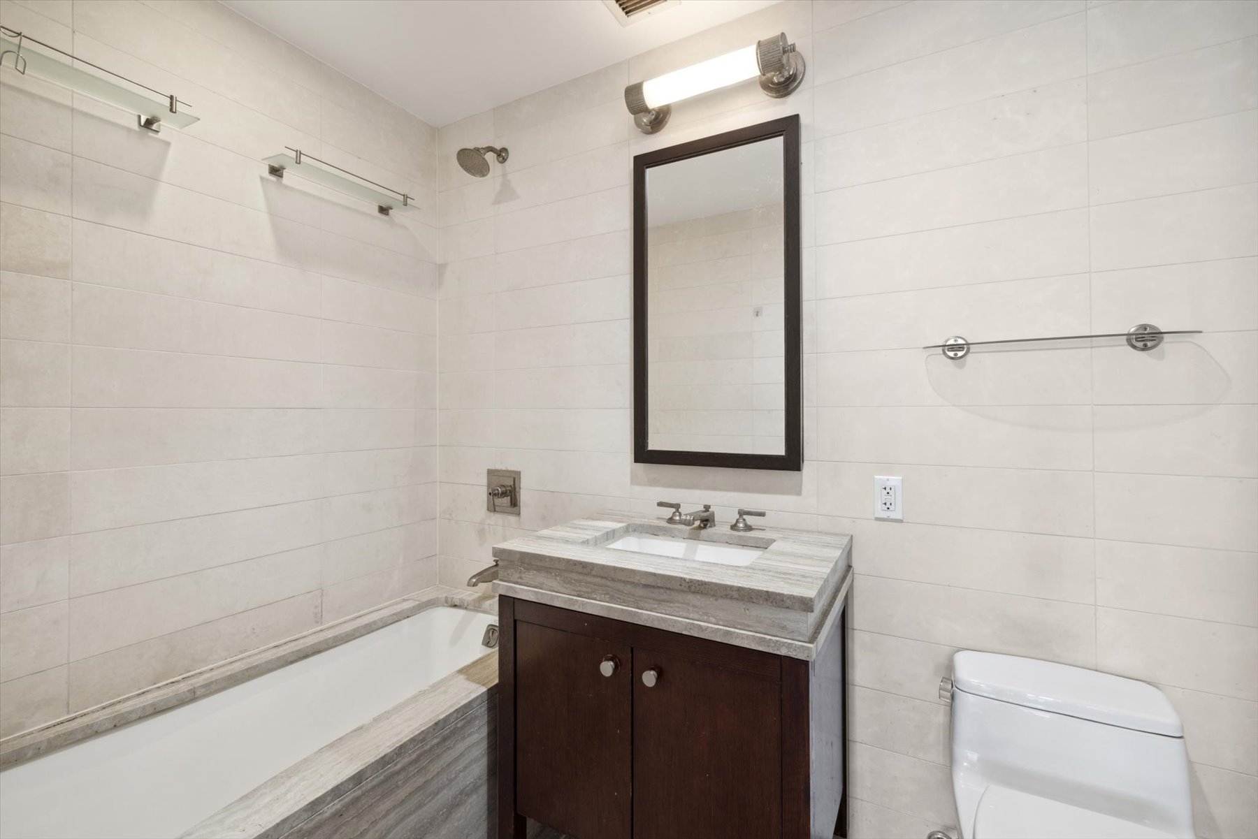 80 Riverside Boulevard, Unit 4X Manhattan, NY 10069 - Photo 7 of 19 a bathroom with a sink a toilet and shower