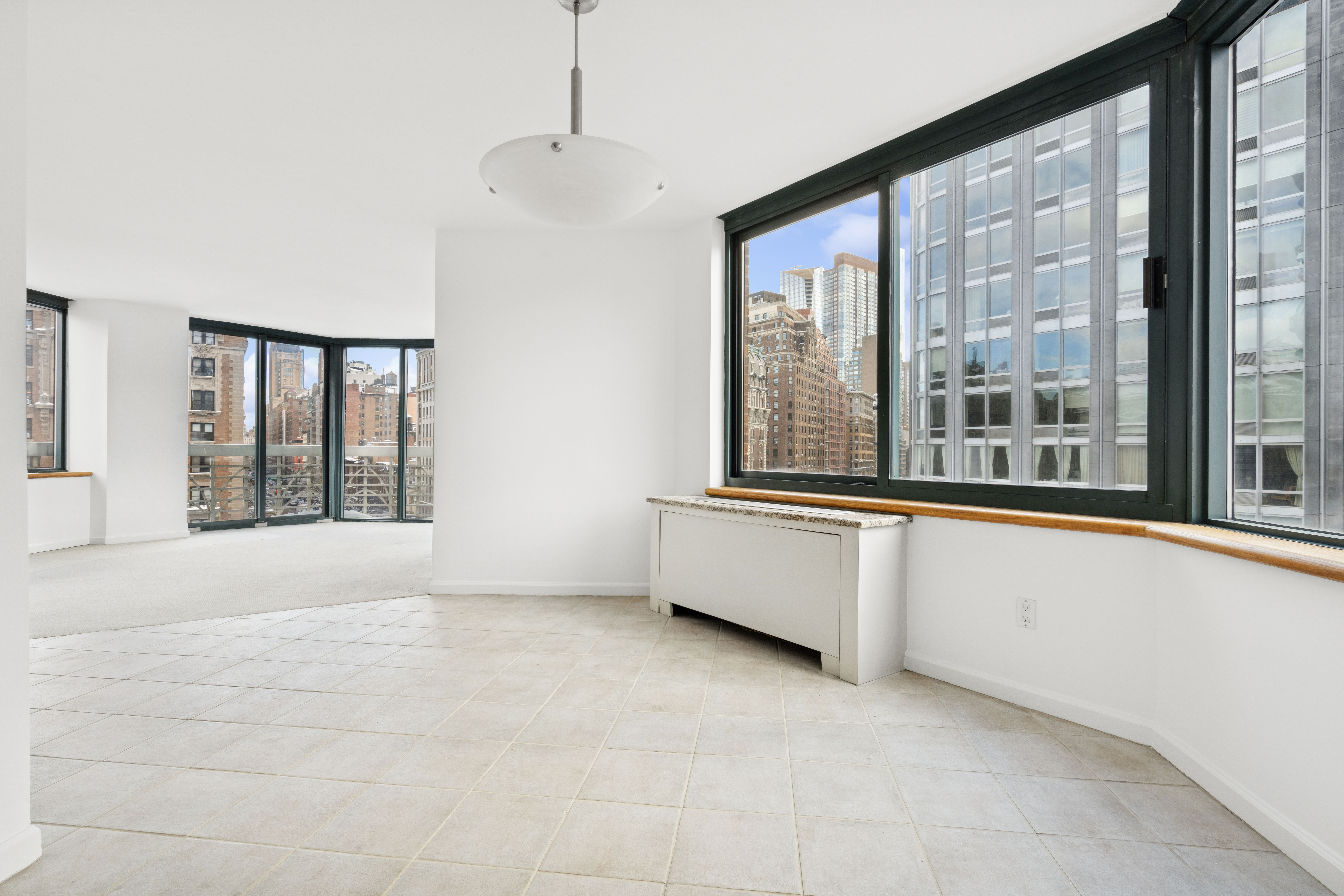 201 West 72nd Street, Unit 8A Manhattan, NY 10023 - Photo 3 of 15 a view of an empty room with a window
