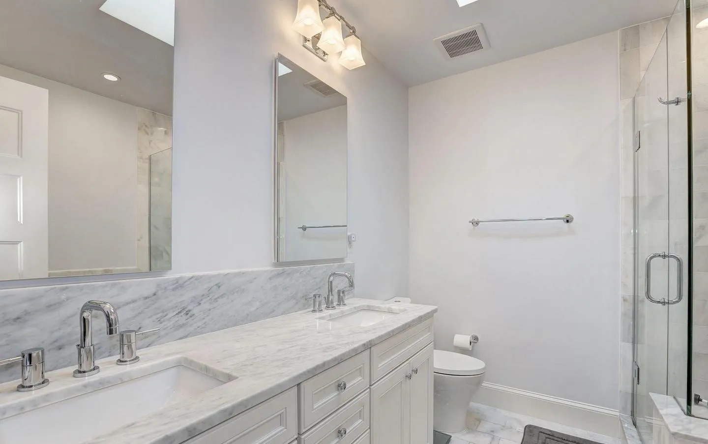 a bathroom with a shower and a sink