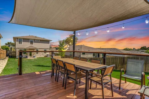 a view of a chairs and table in patio