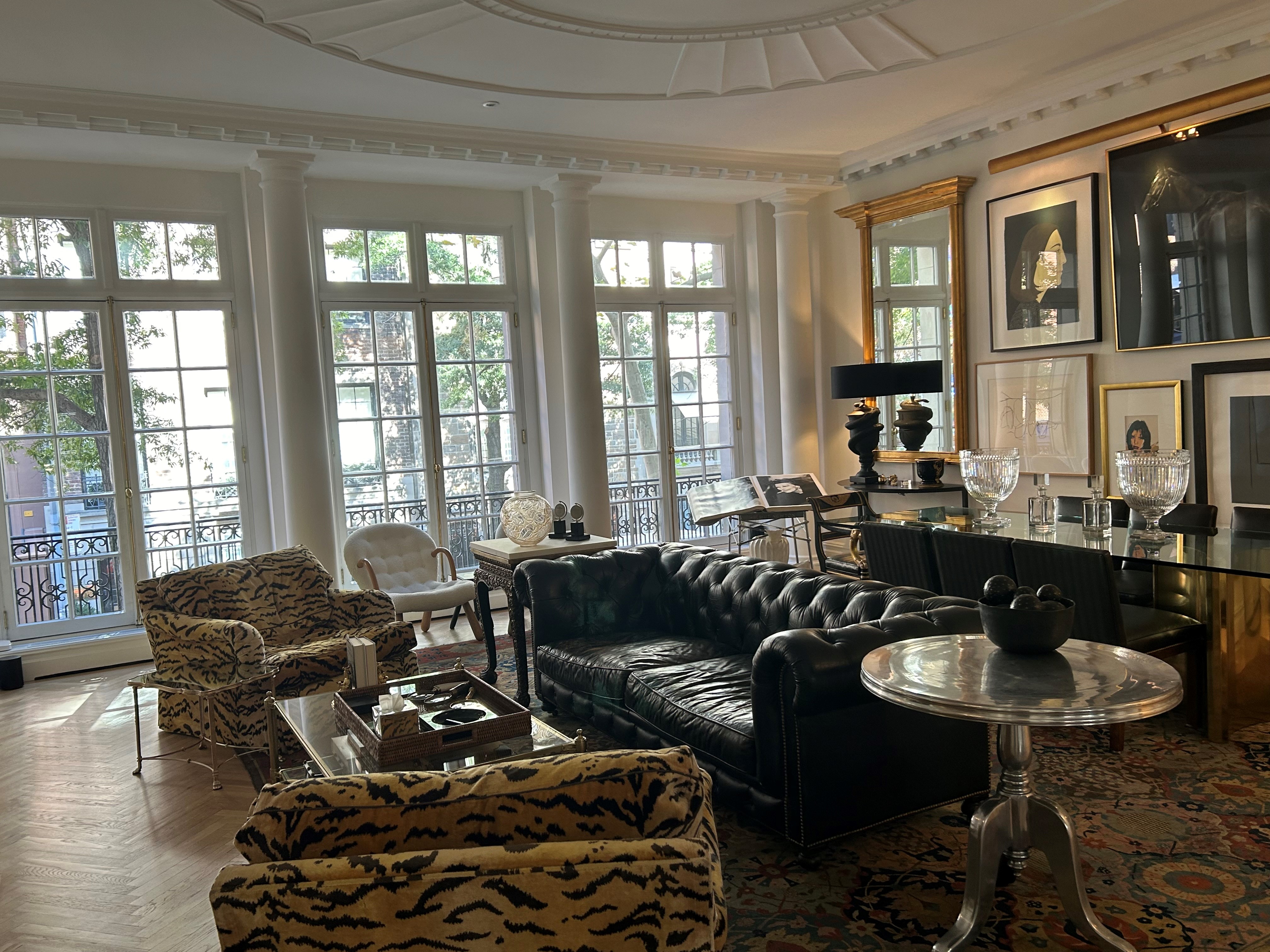 36 East 69th Street, Unit 2AB Manhattan, NY 10021 - Photo 2 of 26 a living room with furniture and floor to ceiling windows